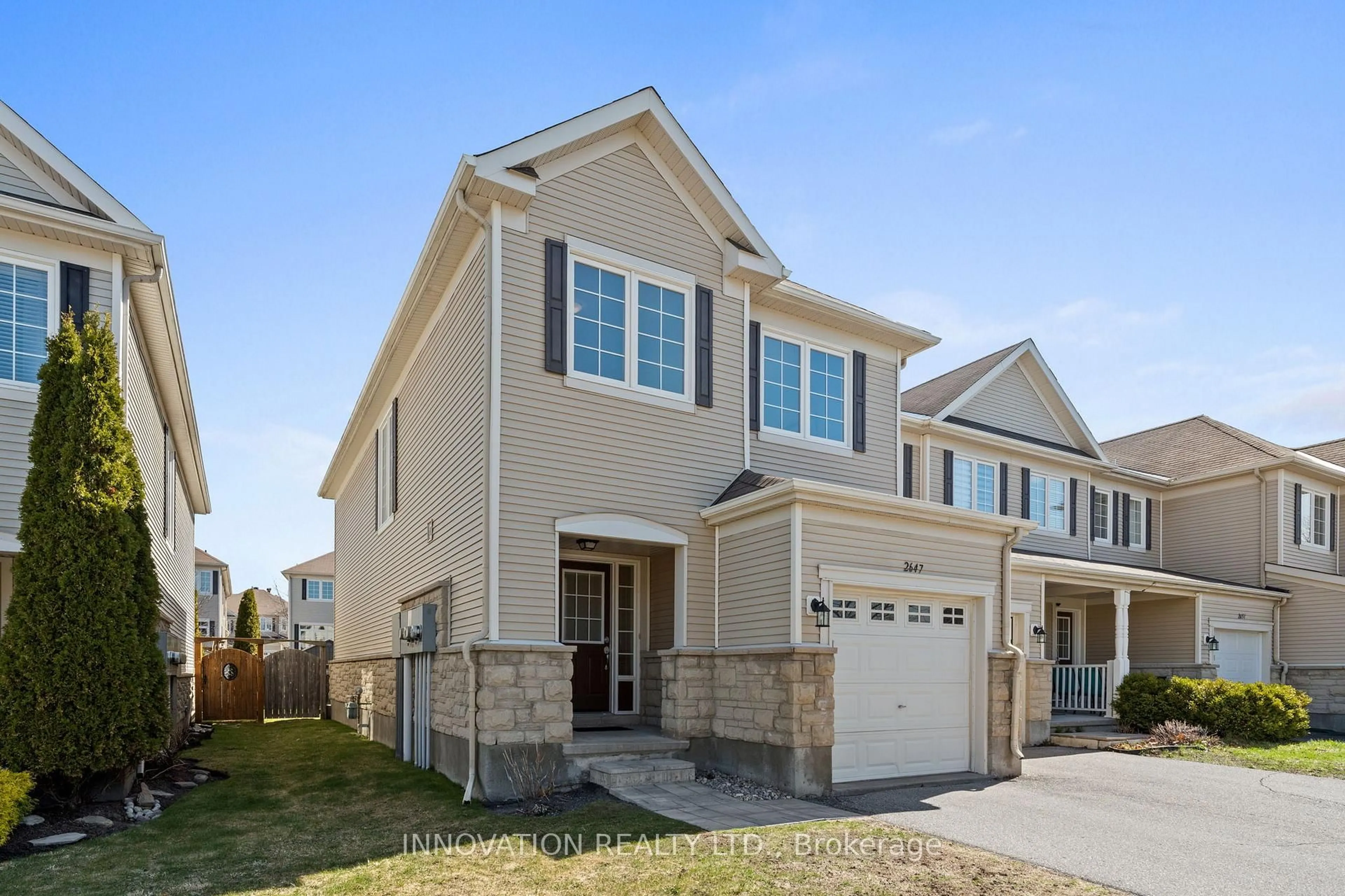 Home with vinyl exterior material, street for 2647 Half Moon Bay Rd, Ottawa Ontario K2J 0Z6