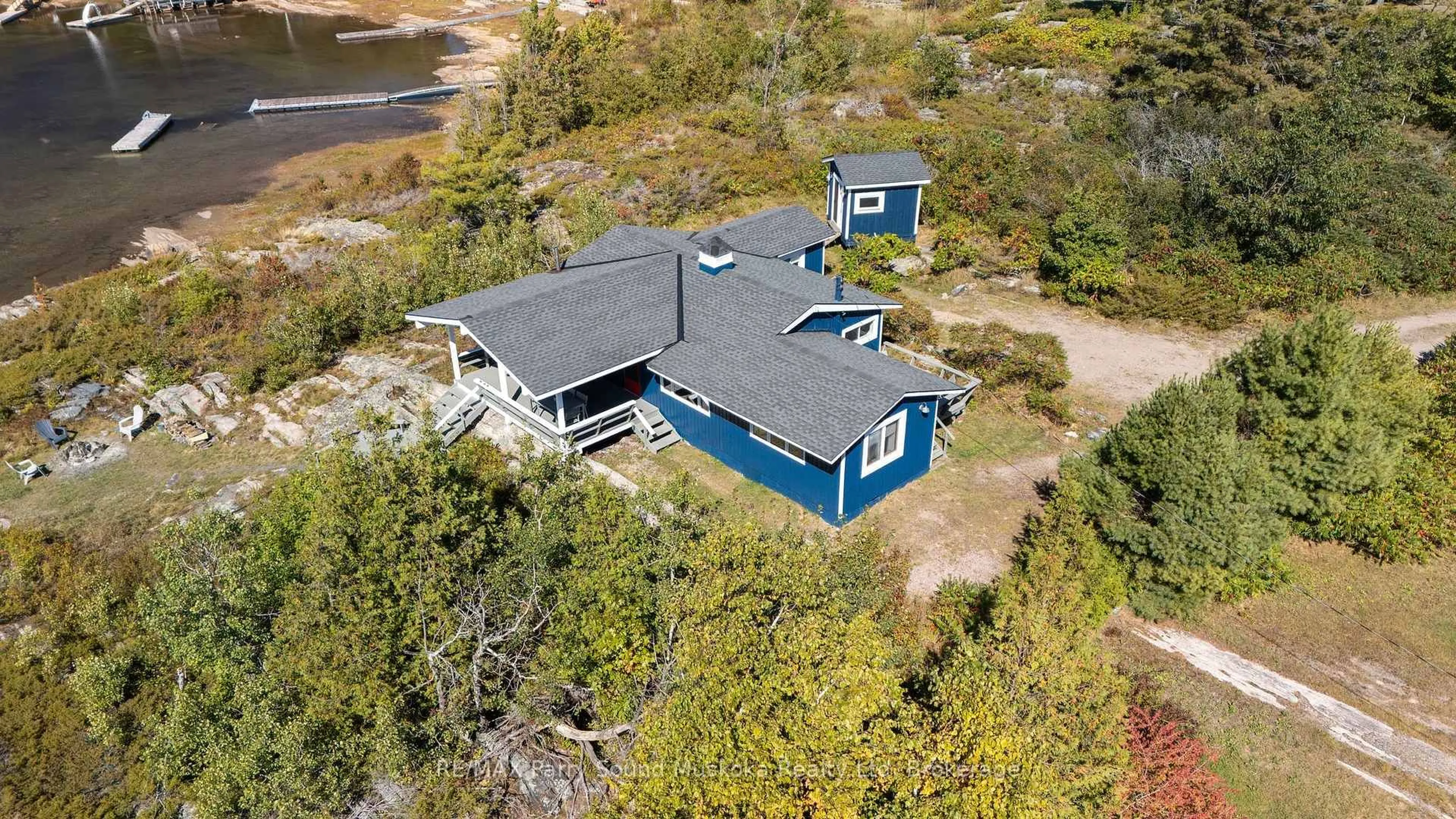 A pic from outside/outdoor area/front of a property/back of a property/a pic from drone, water/lake/river/ocean view for 15 Forsyths Rd, Carling Ontario P0G 1G0
