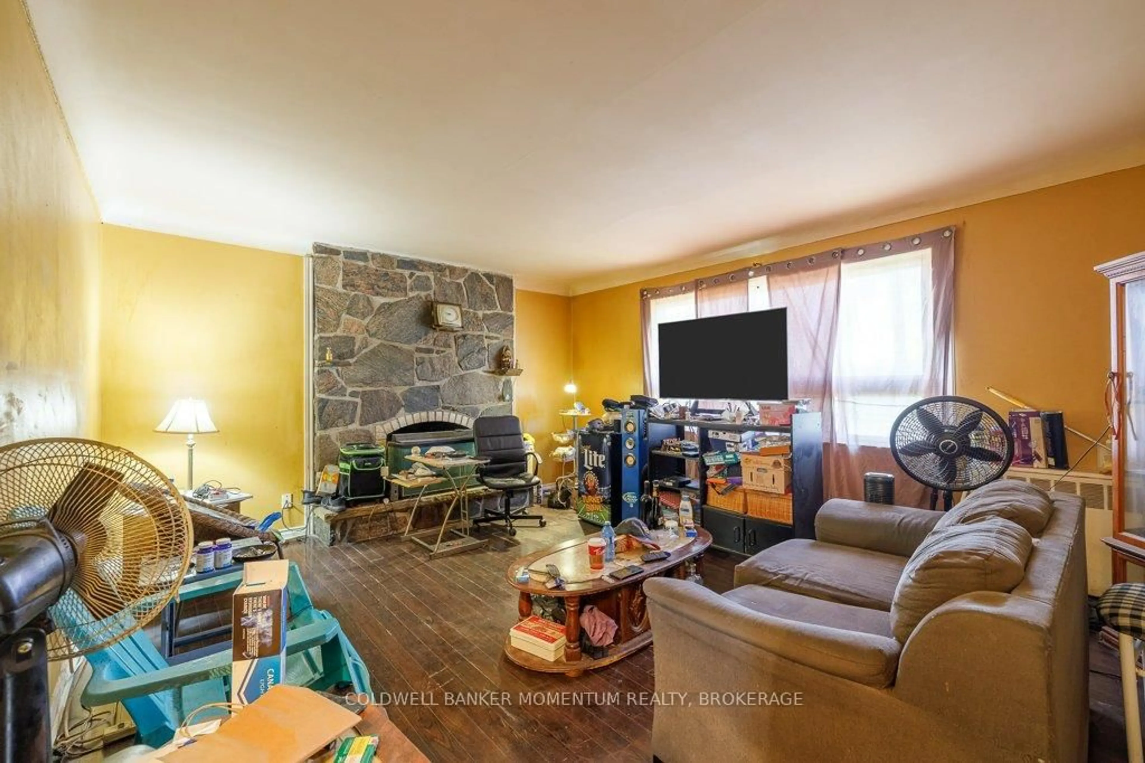 Living room with furniture, wood/laminate floor for 5110 Stanley Ave, Niagara Falls Ontario L2E 5A2