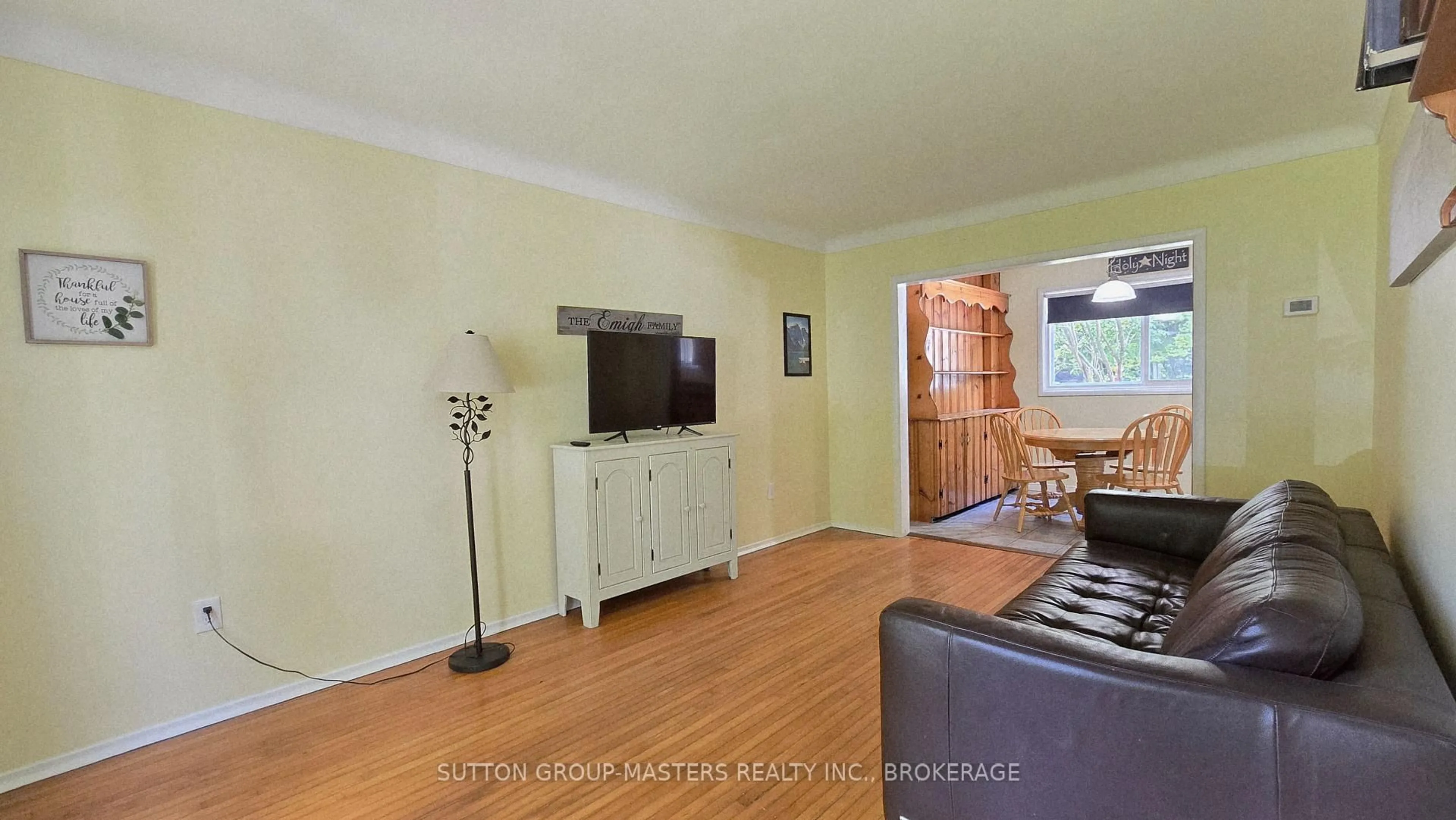 Living room with furniture, wood/laminate floor for 7A Bishop St, Kingston Ontario K7M 3P5