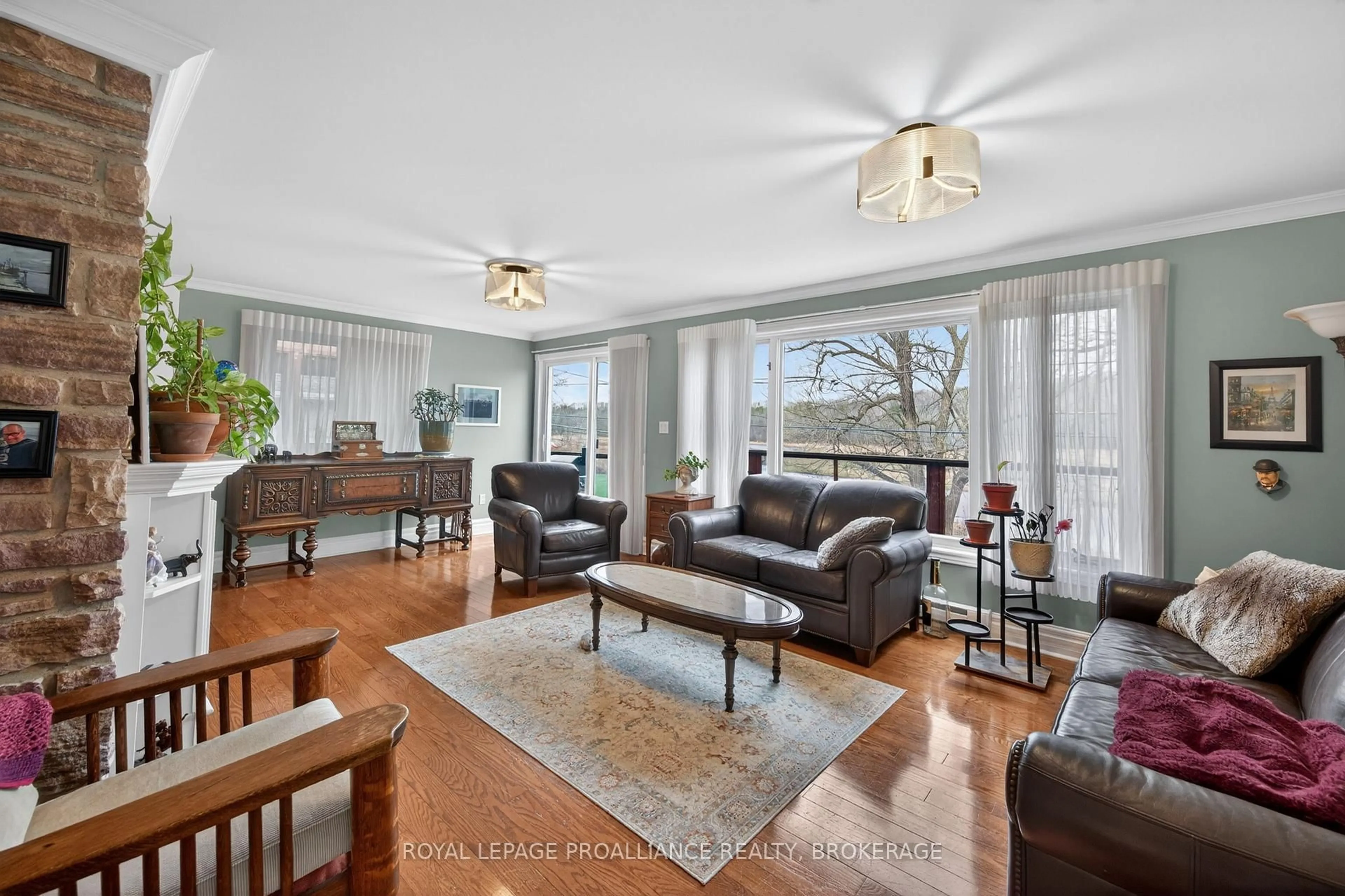 Living room with furniture, wood/laminate floor for 727 Aylmer Cres, Kingston Ontario K7M 6E5