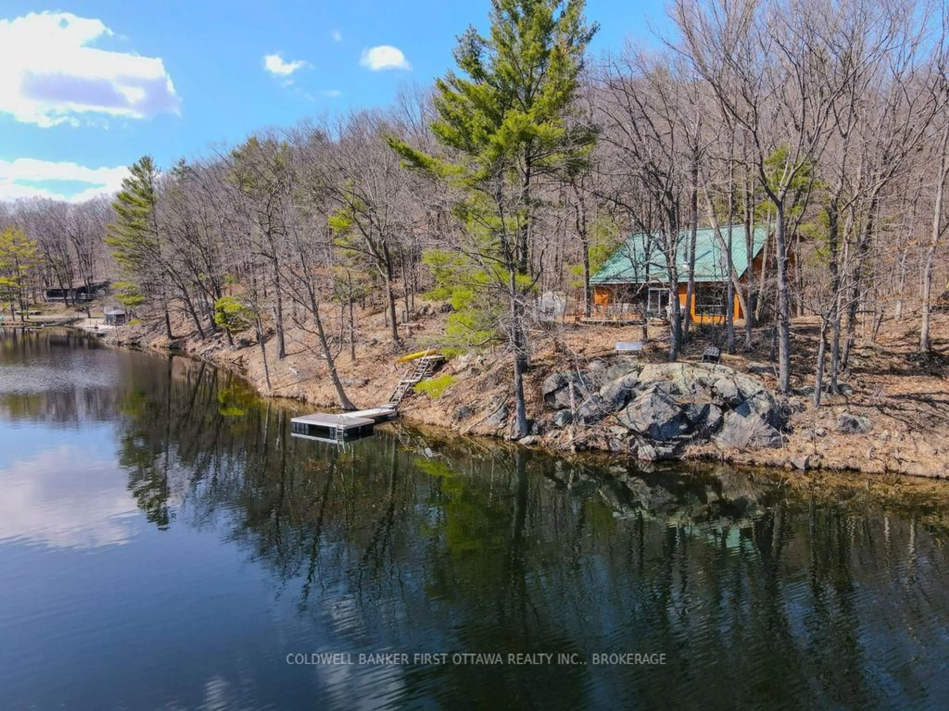 A pic from outside/outdoor area/front of a property/back of a property/a pic from drone, water/lake/river/ocean view for 2238 Little Long Lake Rd, Sydenham Ontario K0H 2T0