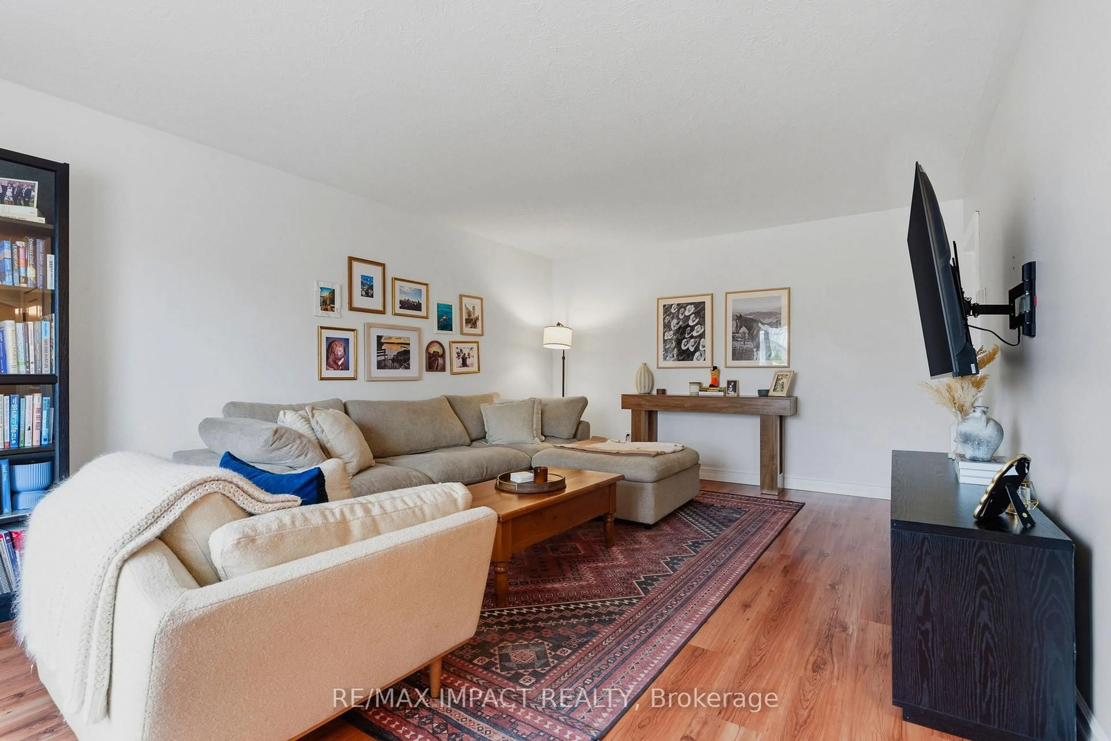 Living room with furniture, wood/laminate floor for 192 McClennan St, Peterborough Ontario K9H 5H7