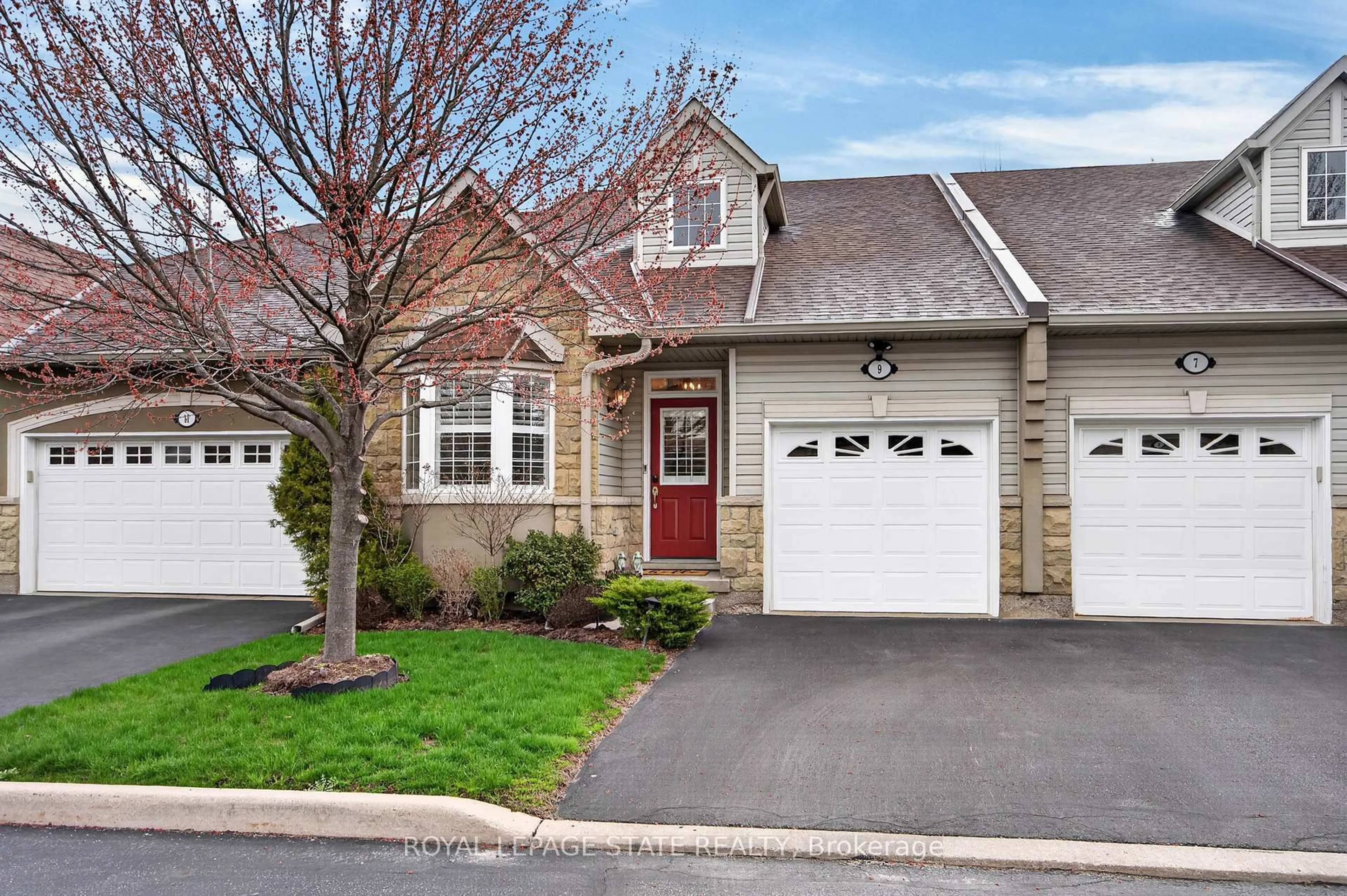 Home with vinyl exterior material, street for 212 Stonehenge Dr #9, Hamilton Ontario L9K 1N5