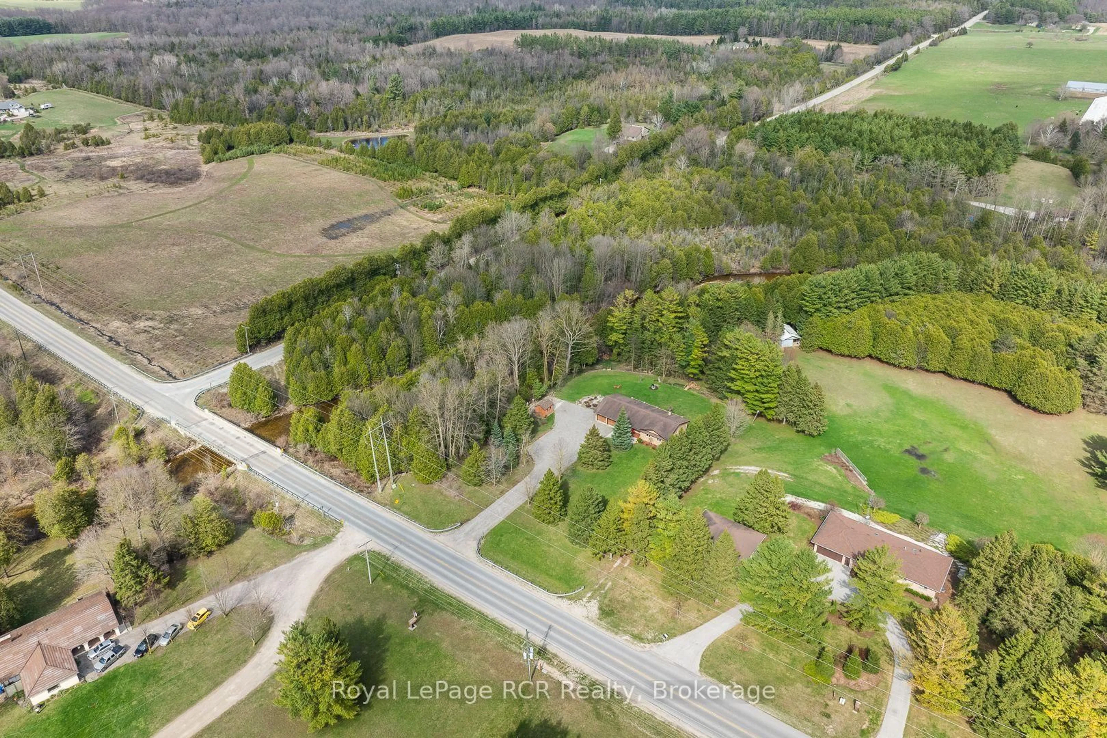 A pic from outside/outdoor area/front of a property/back of a property/a pic from drone, forest/trees view for 033105 Grey Road 28 Rd, West Grey Ontario N4N 3B8