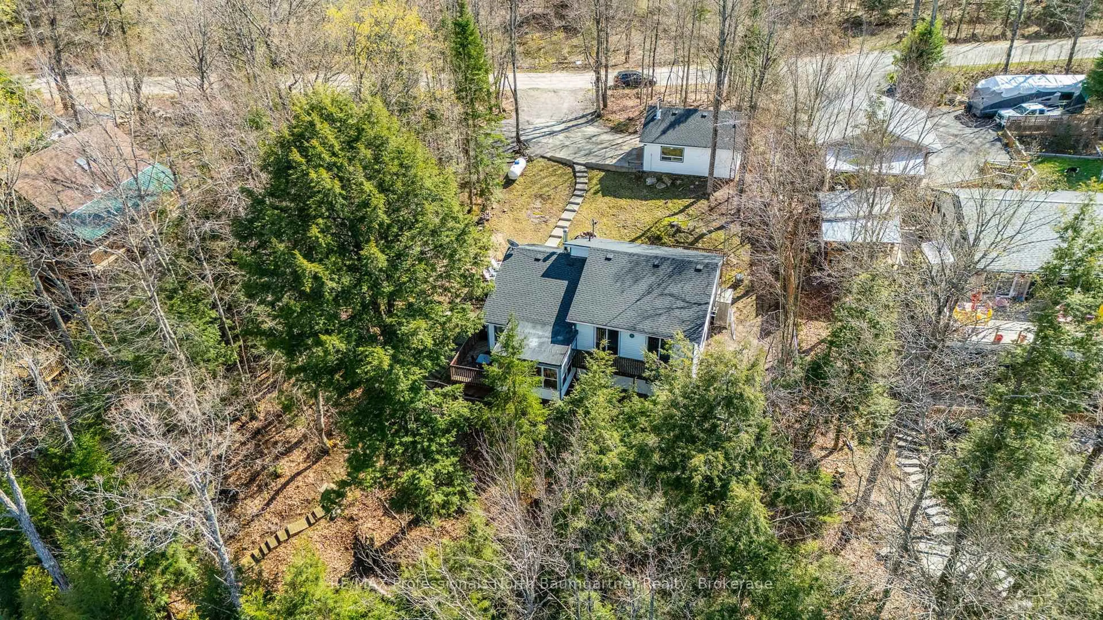 A pic from outside/outdoor area/front of a property/back of a property/a pic from drone, forest/trees view for 1053 Mink Rd, Dysart et al Ontario K0M 1S0