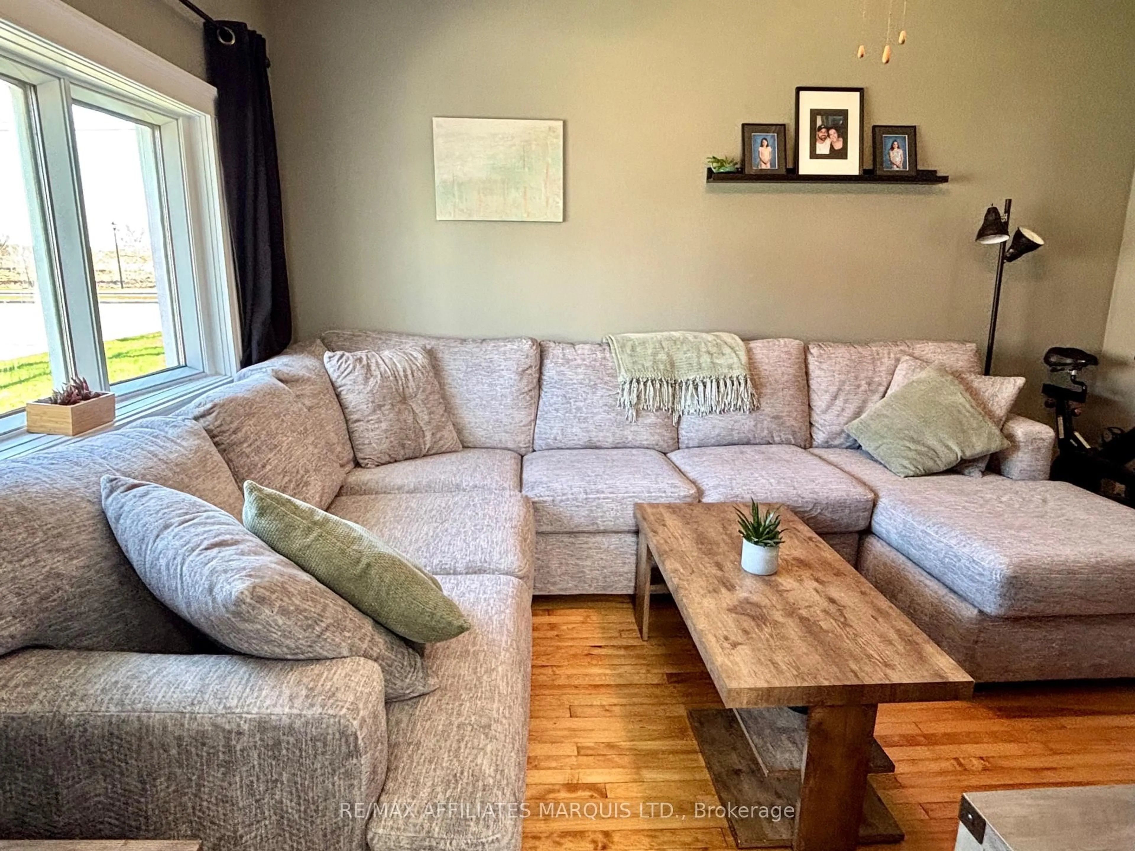 Living room with furniture, wood/laminate floor for 4 Seymour Ave, Cornwall Ontario K6J 4L7