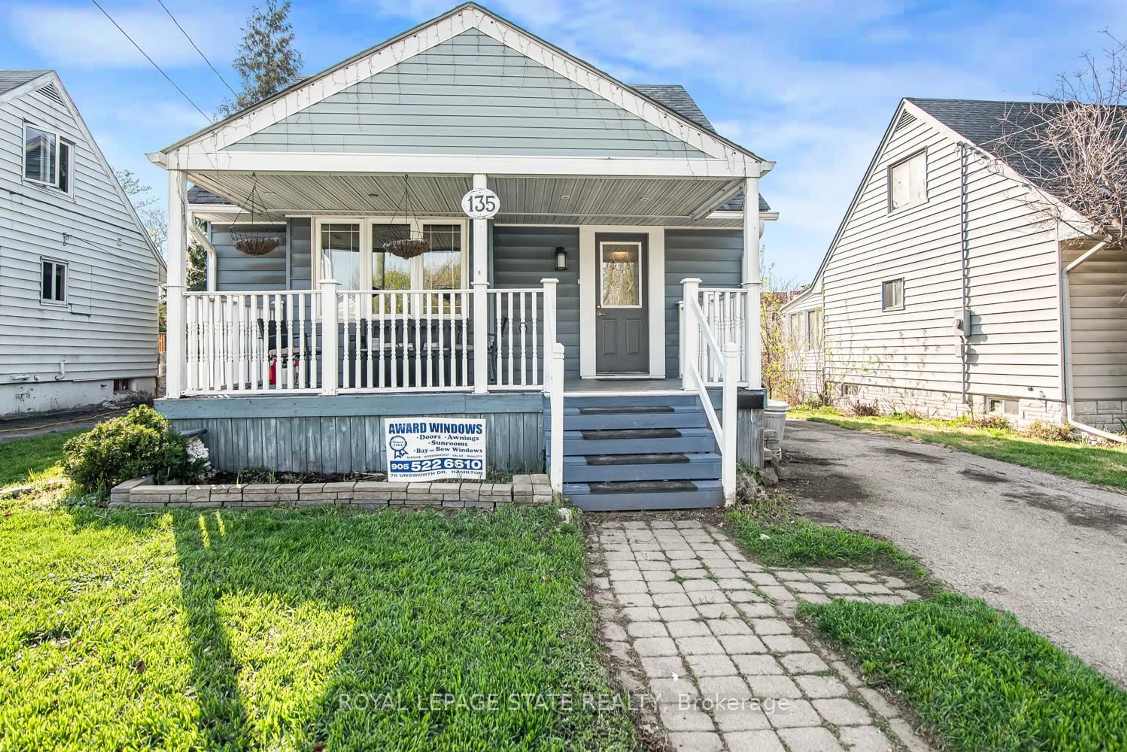 Home with vinyl exterior material, street for 135 Glassco Ave, Hamilton Ontario L8H 6A1