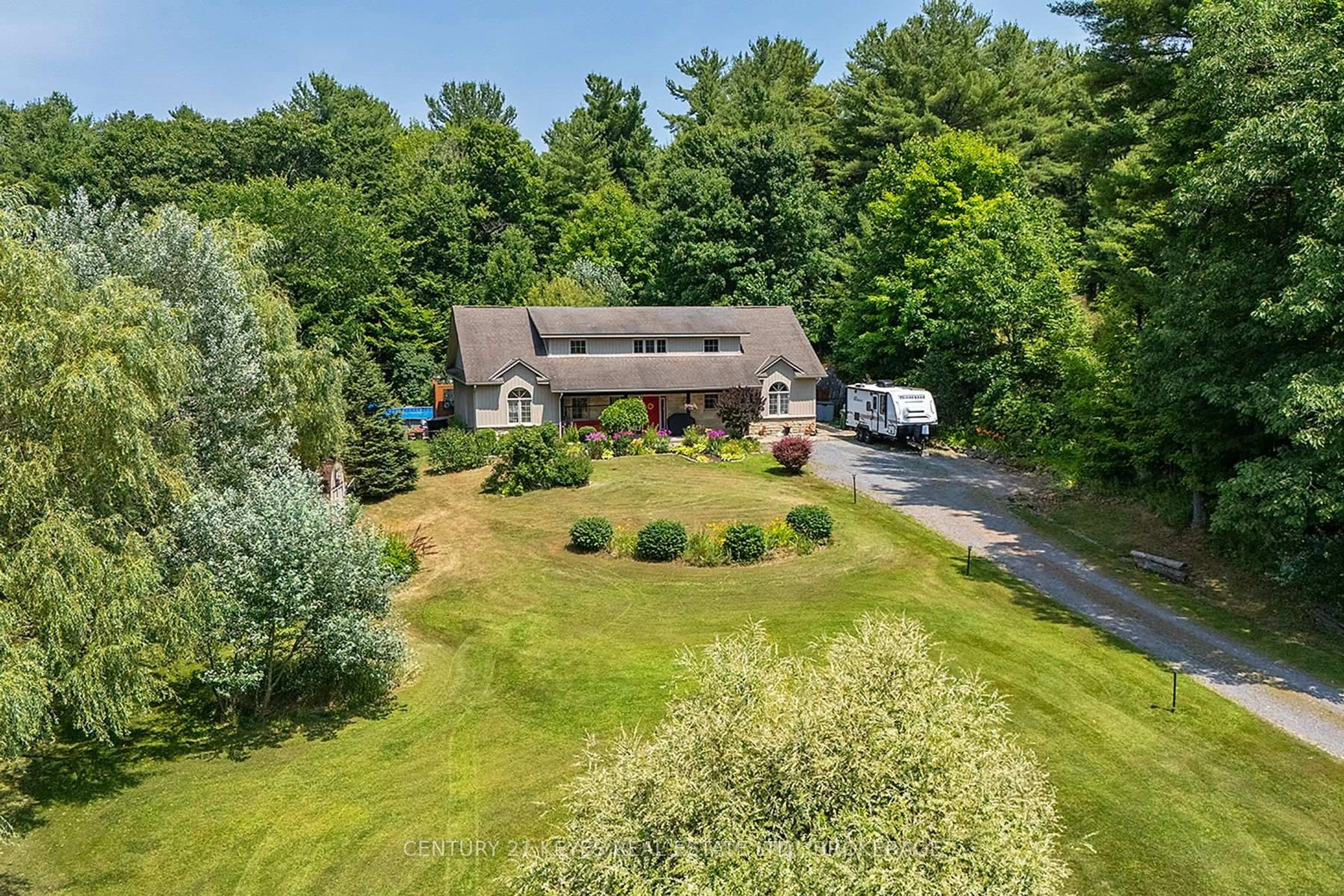 A pic from outside/outdoor area/front of a property/back of a property/a pic from drone, unknown for 211 Fitzsimmons Rd, Leeds and the Thousand Islands Ontario K0E 1L0