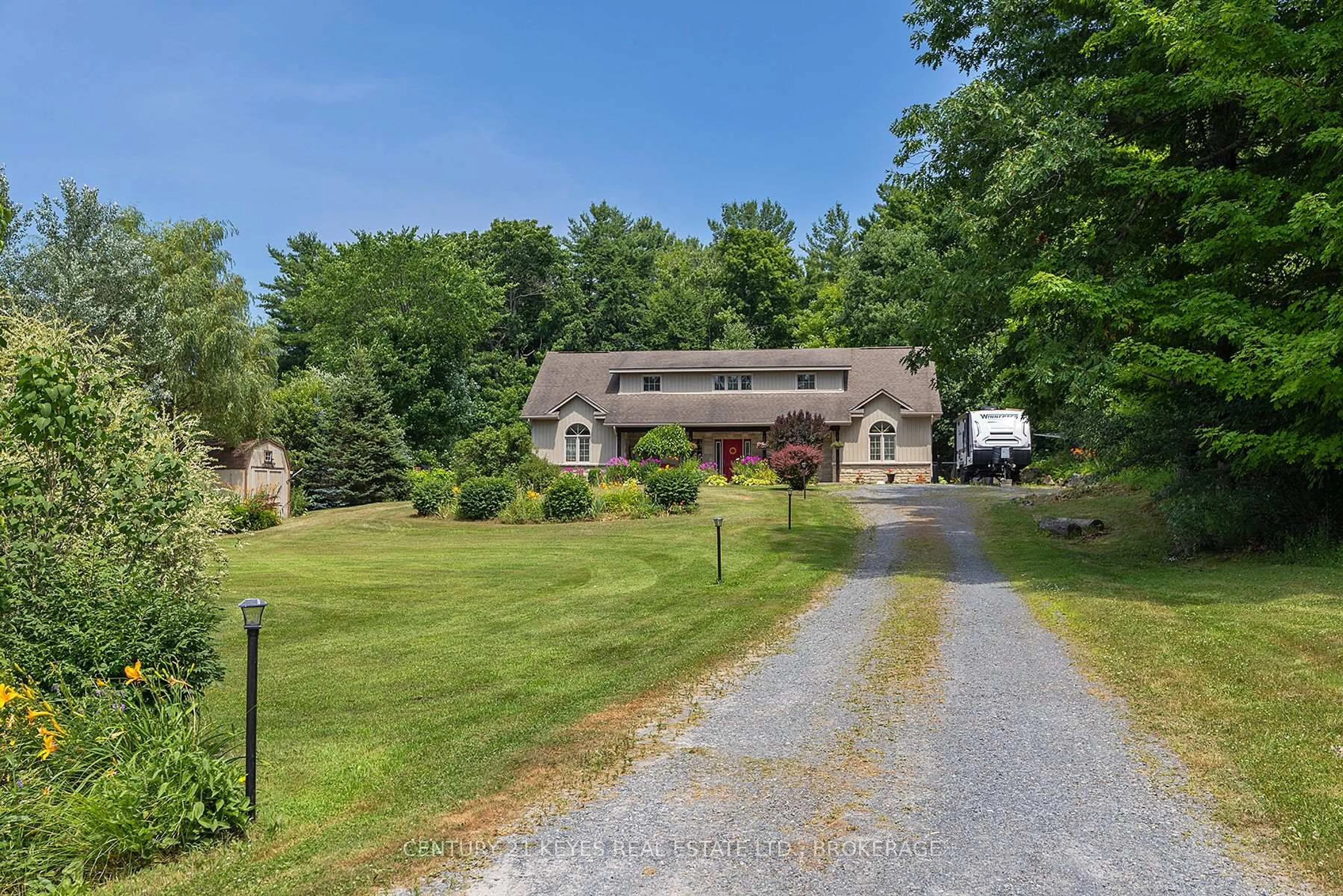 A pic from outside/outdoor area/front of a property/back of a property/a pic from drone, street for 211 Fitzsimmons Rd, Leeds and the Thousand Islands Ontario K0E 1L0