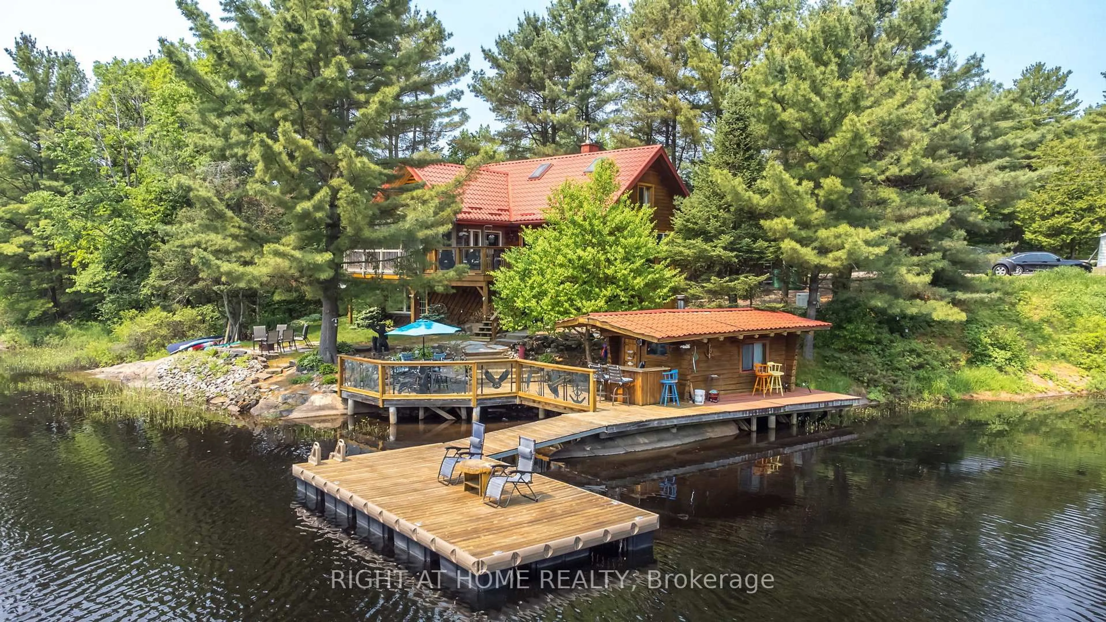 A pic from outside/outdoor area/front of a property/back of a property/a pic from drone, water/lake/river/ocean view for 235 LOCH ERNE Rd, McDougall Ontario P2A 2W7