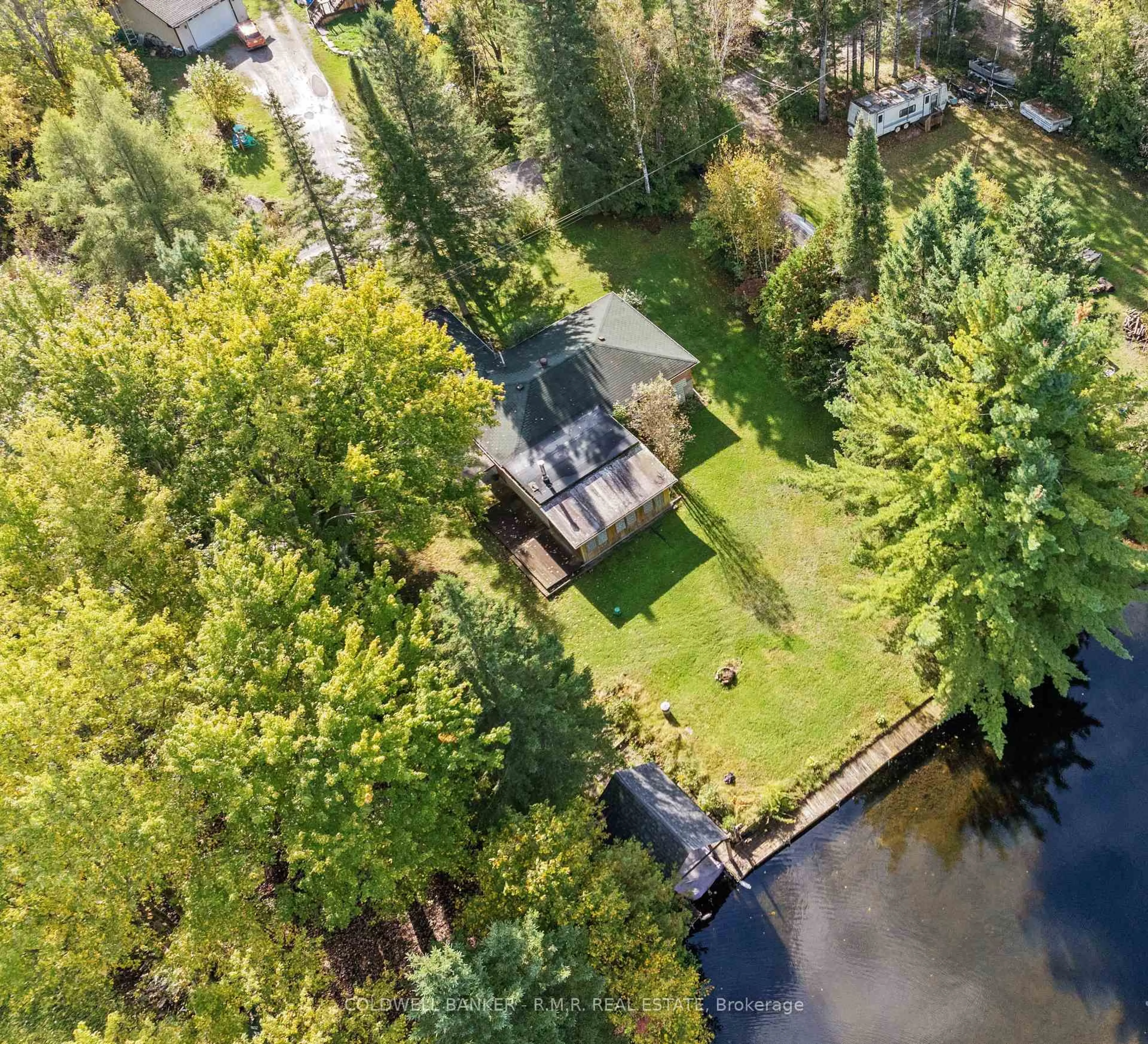 A pic from outside/outdoor area/front of a property/back of a property/a pic from drone, water/lake/river/ocean view for 57 Fire Route 104, Trent Lakes Ontario K0M 1A0
