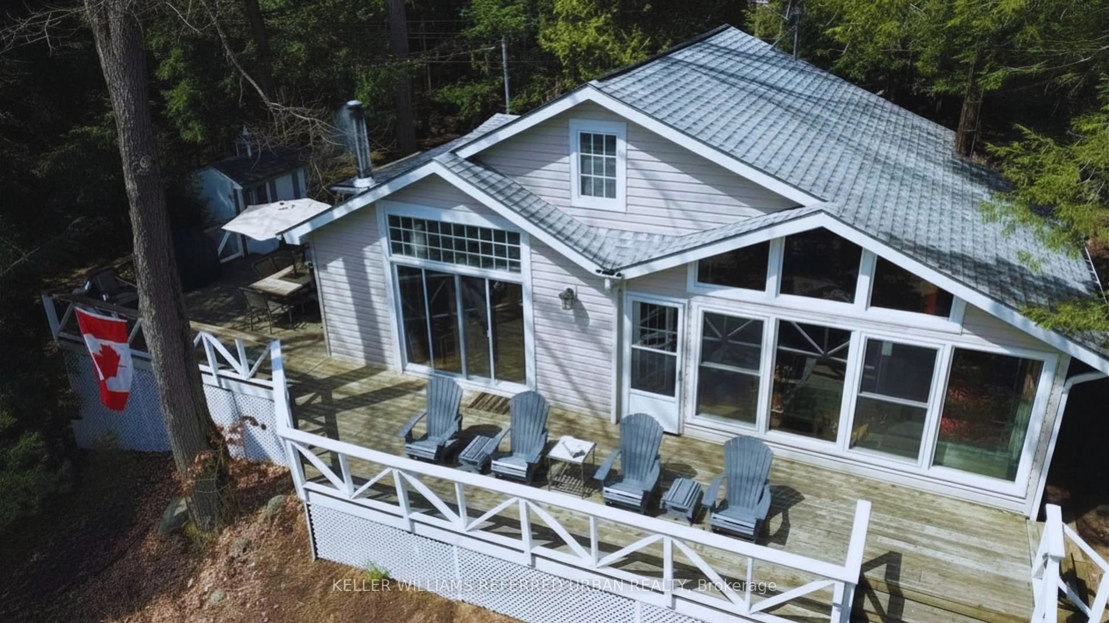 A pic from outside/outdoor area/front of a property/back of a property/a pic from drone, water/lake/river/ocean view for 1118 Pine Lake Shores, Bracebridge Ontario P1L 1X3