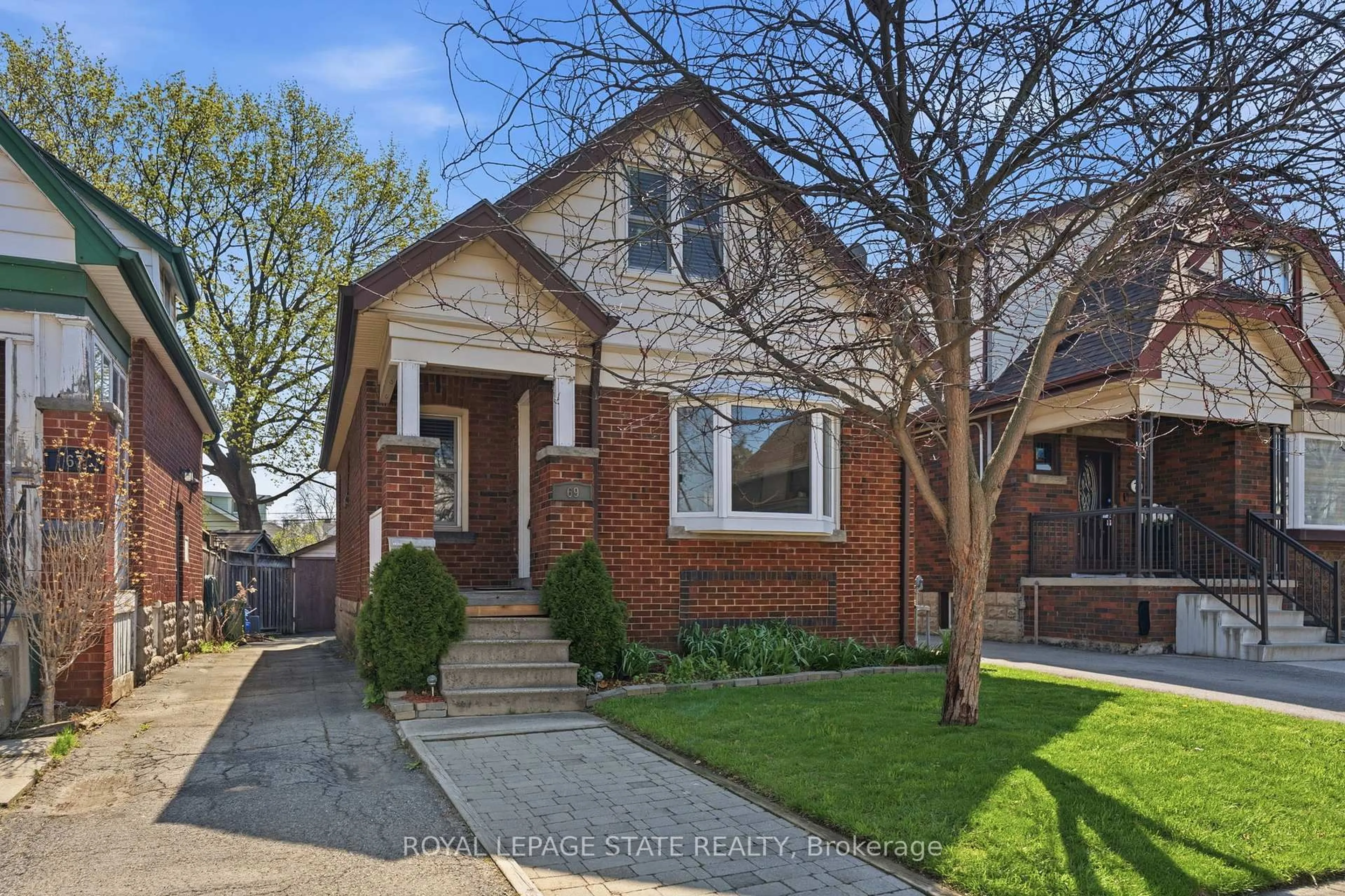 Home with brick exterior material, street for 69 Houghton Ave, Hamilton Ontario L8K 2M9