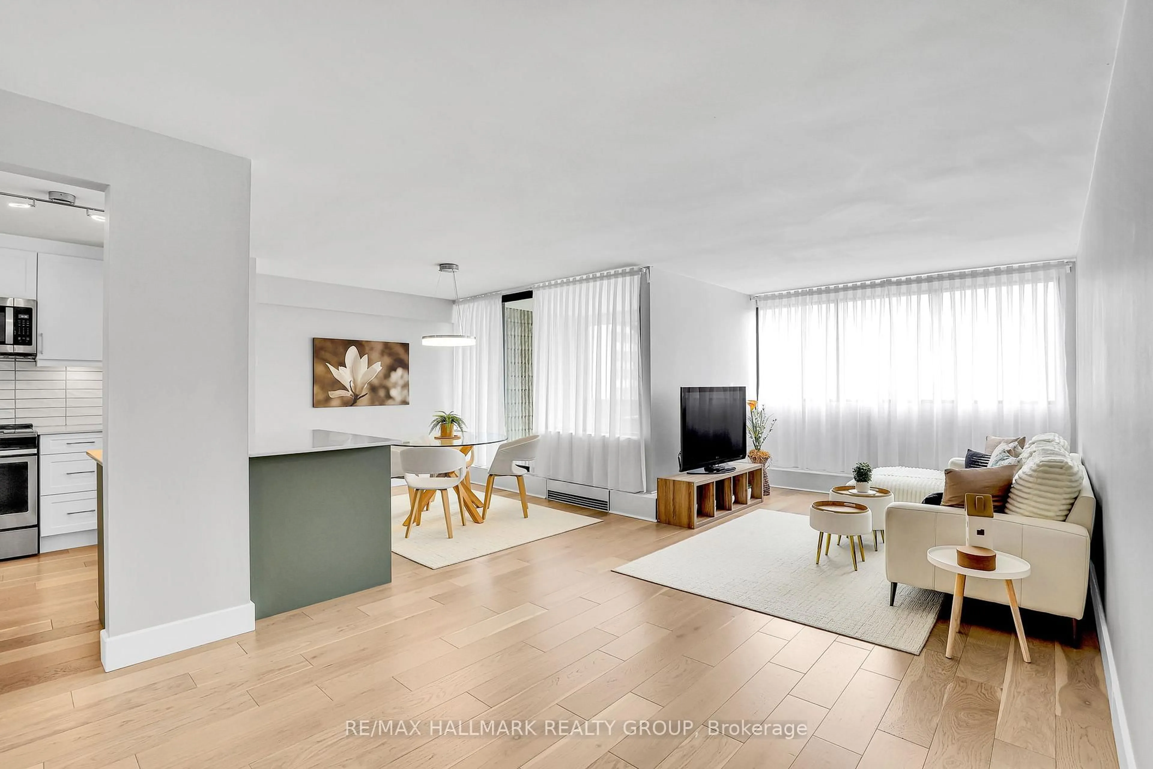 Living room with furniture, wood/laminate floor for 1285 Cahill Dr #1604, Ottawa Ontario K1V 9A7