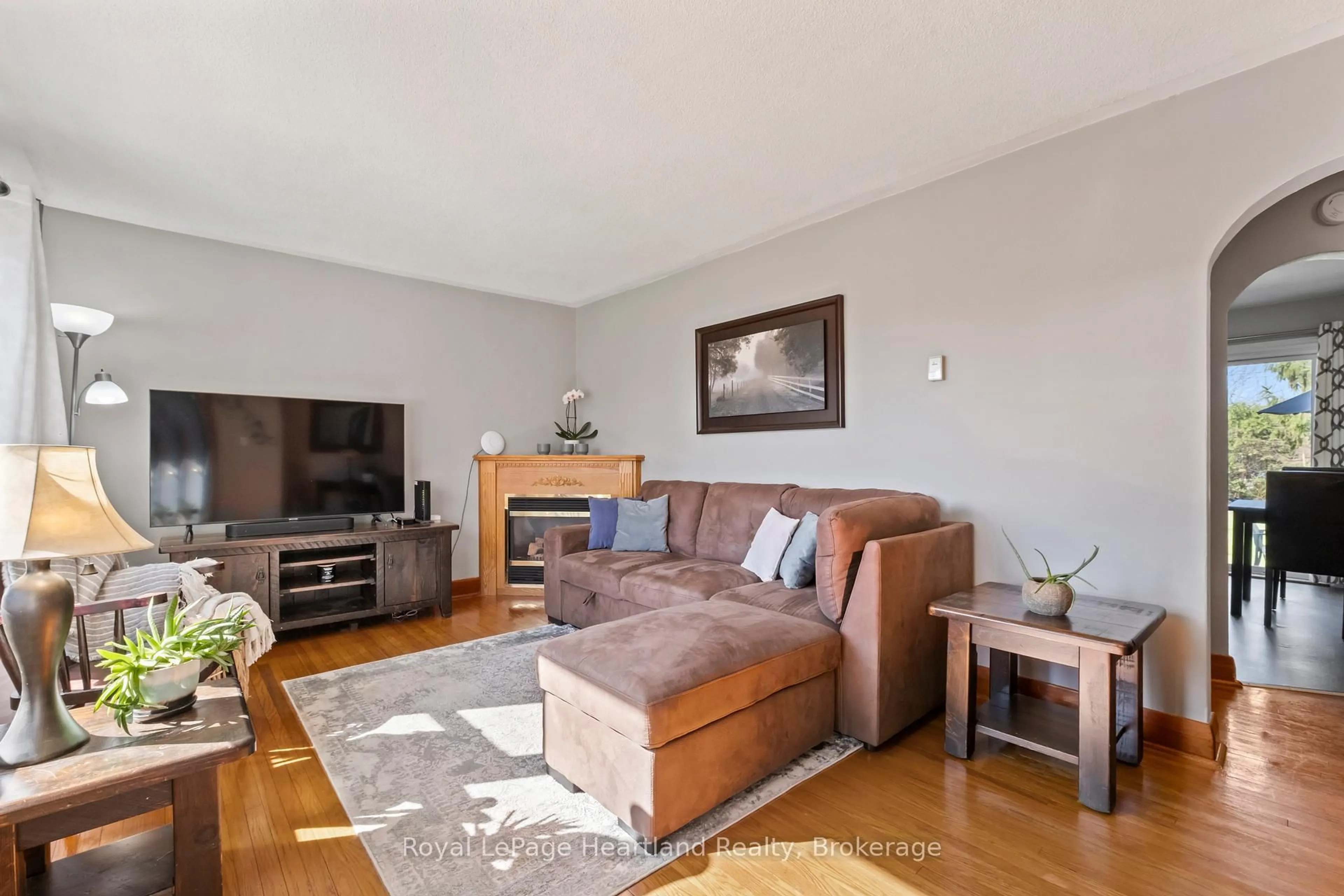 Living room with furniture, wood/laminate floor for 117 Andrew St, South Huron Ontario N0M 1S1