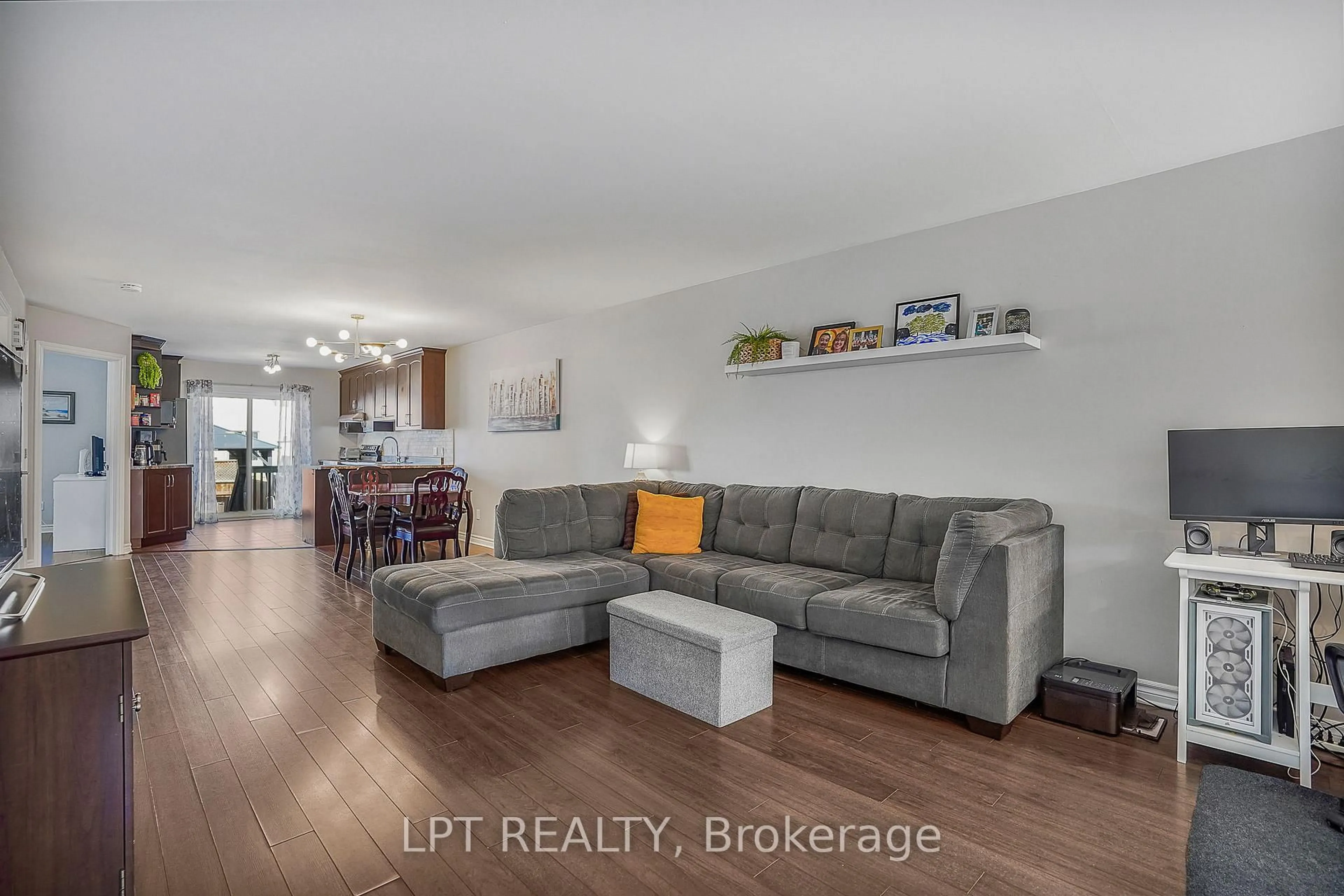 Living room with furniture, wood/laminate floor for 90 Brunet St, The Nation Ontario K0A 2M0