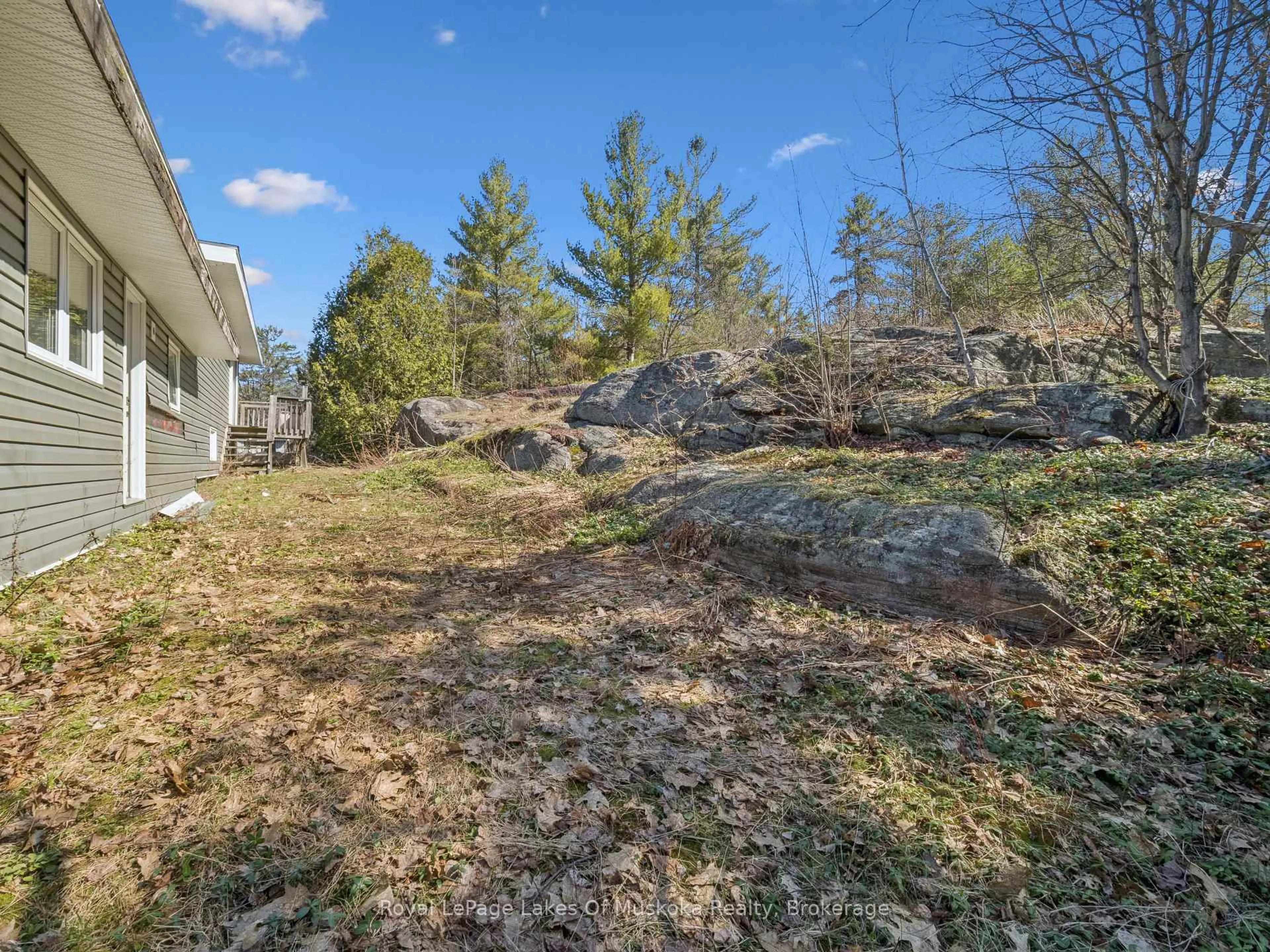 A pic from outside/outdoor area/front of a property/back of a property/a pic from drone, forest/trees view for 1314 Winhara Rd, Gravenhurst Ontario P1P 1R1