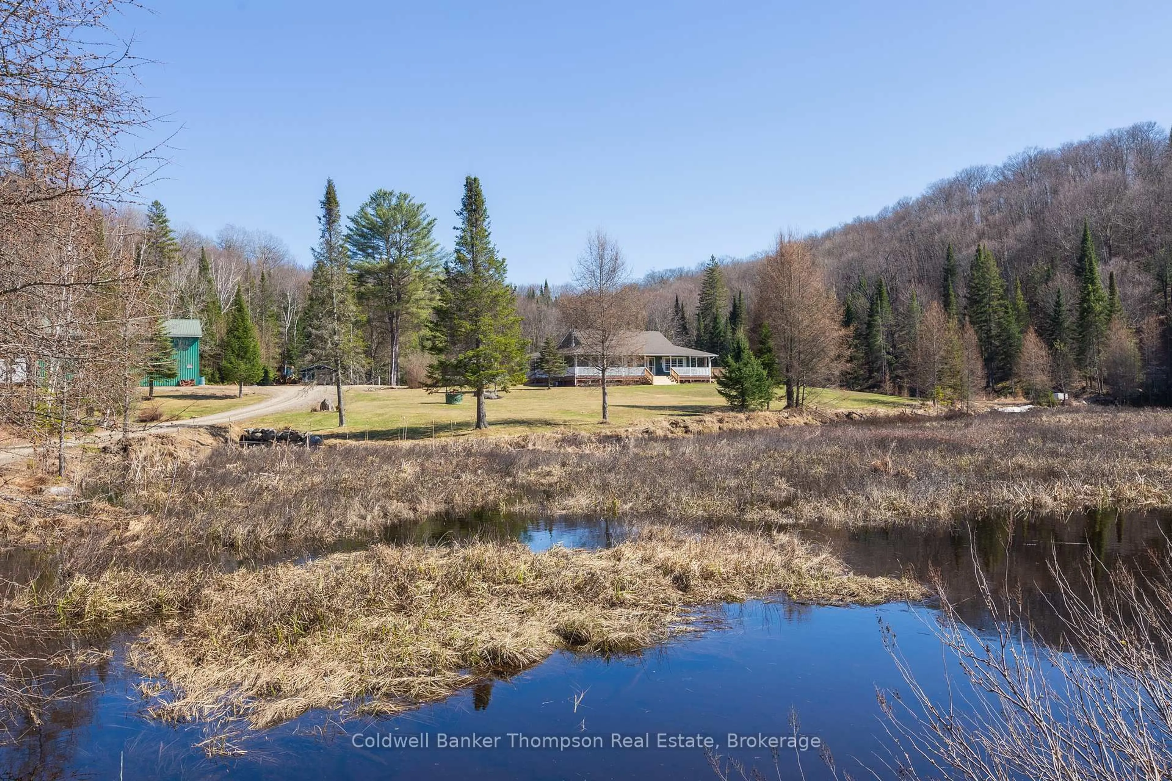 A pic from outside/outdoor area/front of a property/back of a property/a pic from drone, water/lake/river/ocean view for 448 Long Lake Rd, Perry Ontario P0A 1R0