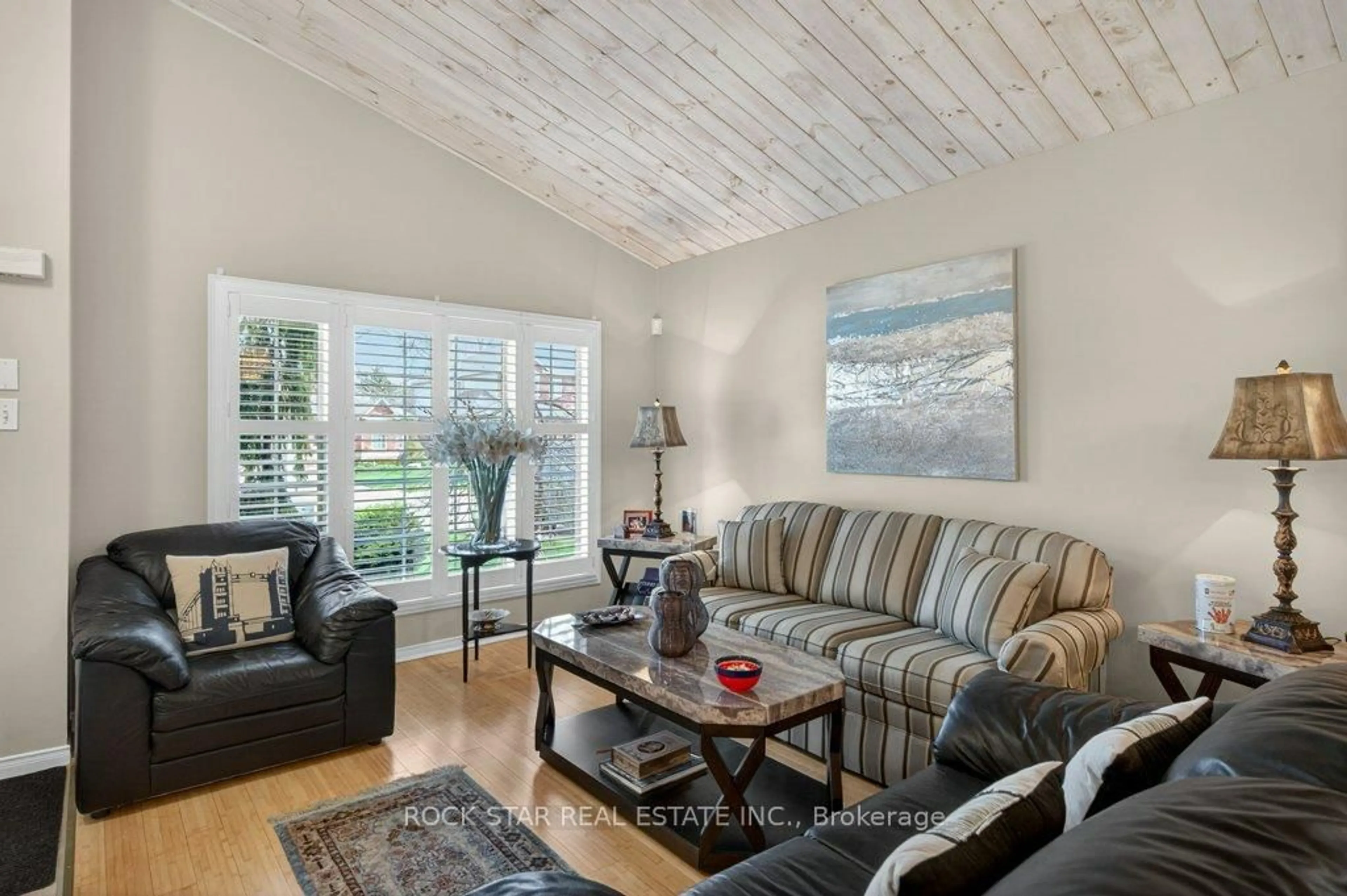 Living room with furniture, wood/laminate floor for 35 Hepburn Cres, Hamilton Ontario L9C 7S4