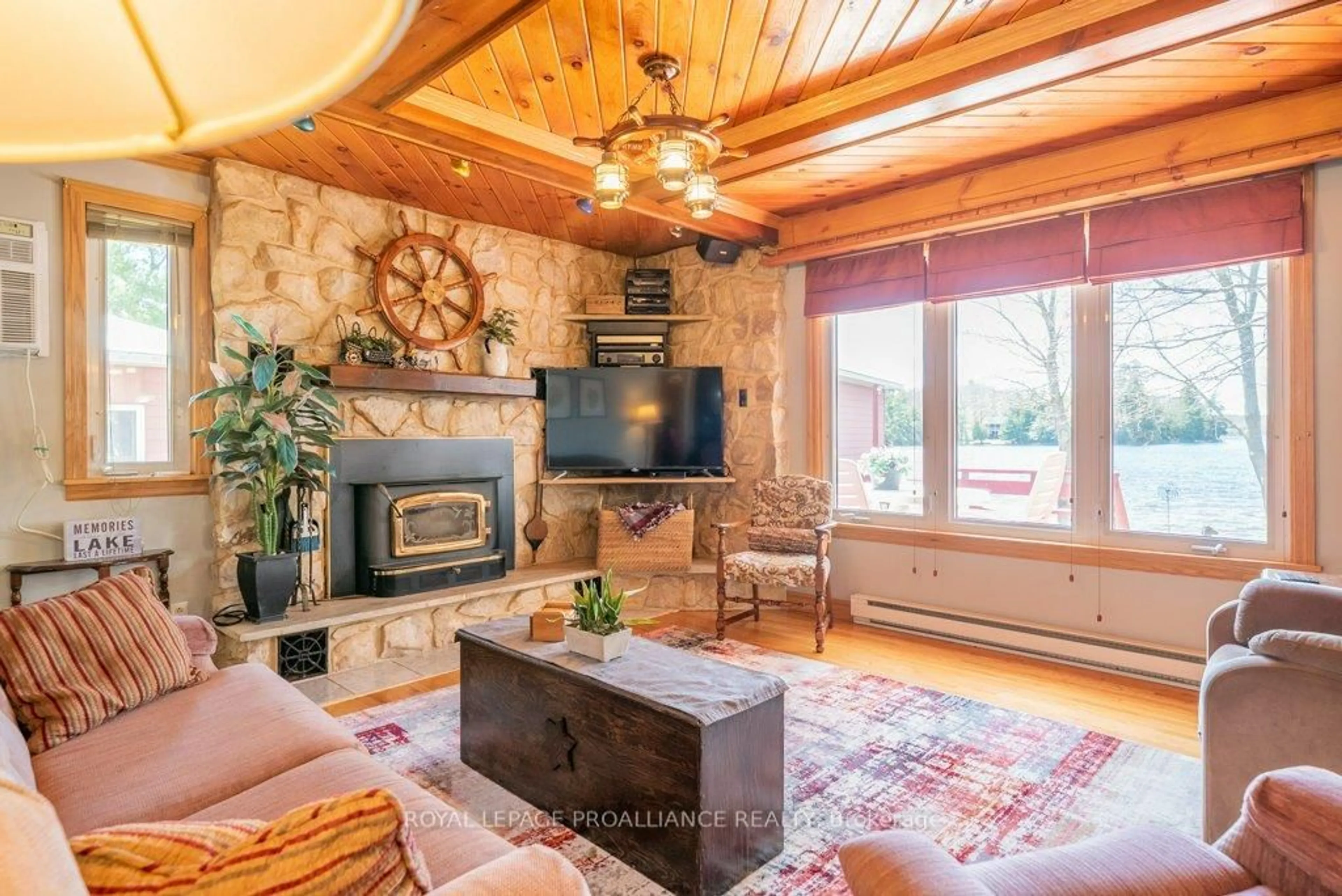 Living room with furniture, wood/laminate floor for 1063 Perry Rd, Cloyne Ontario K0H 1K0