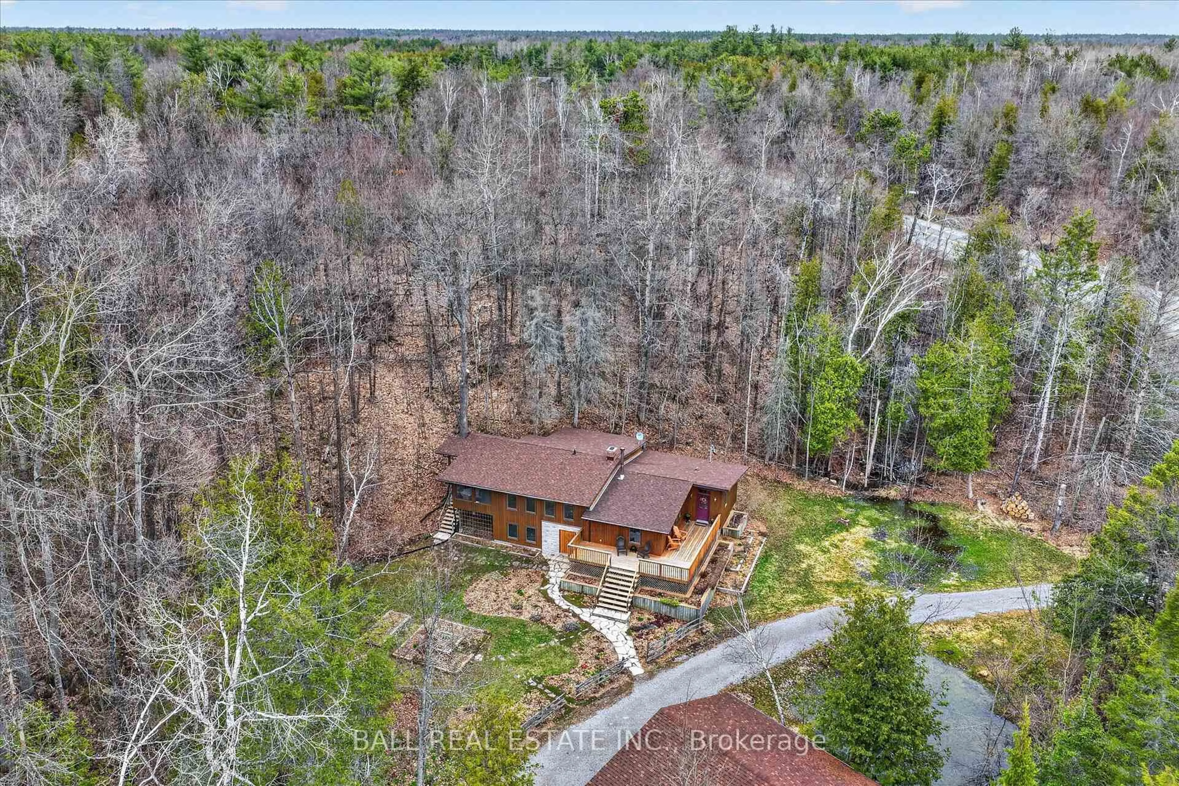 A pic from outside/outdoor area/front of a property/back of a property/a pic from drone, forest/trees view for 6550 Highway 28, North Kawartha Ontario K0L 3E0