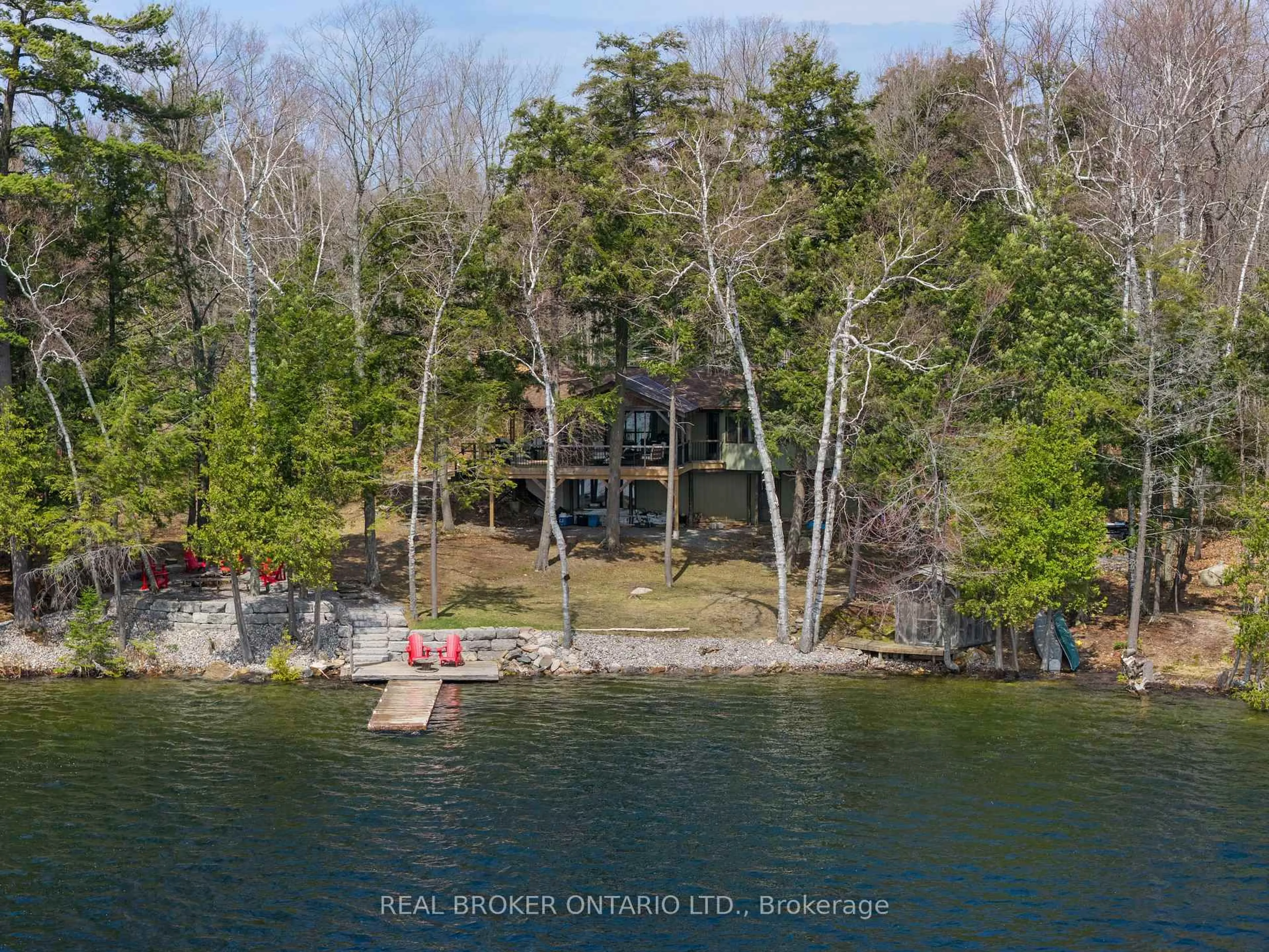 A pic from outside/outdoor area/front of a property/back of a property/a pic from drone, water/lake/river/ocean view for 2323 Grindstone Lake Rd, Plevna Ontario K0H 2M0