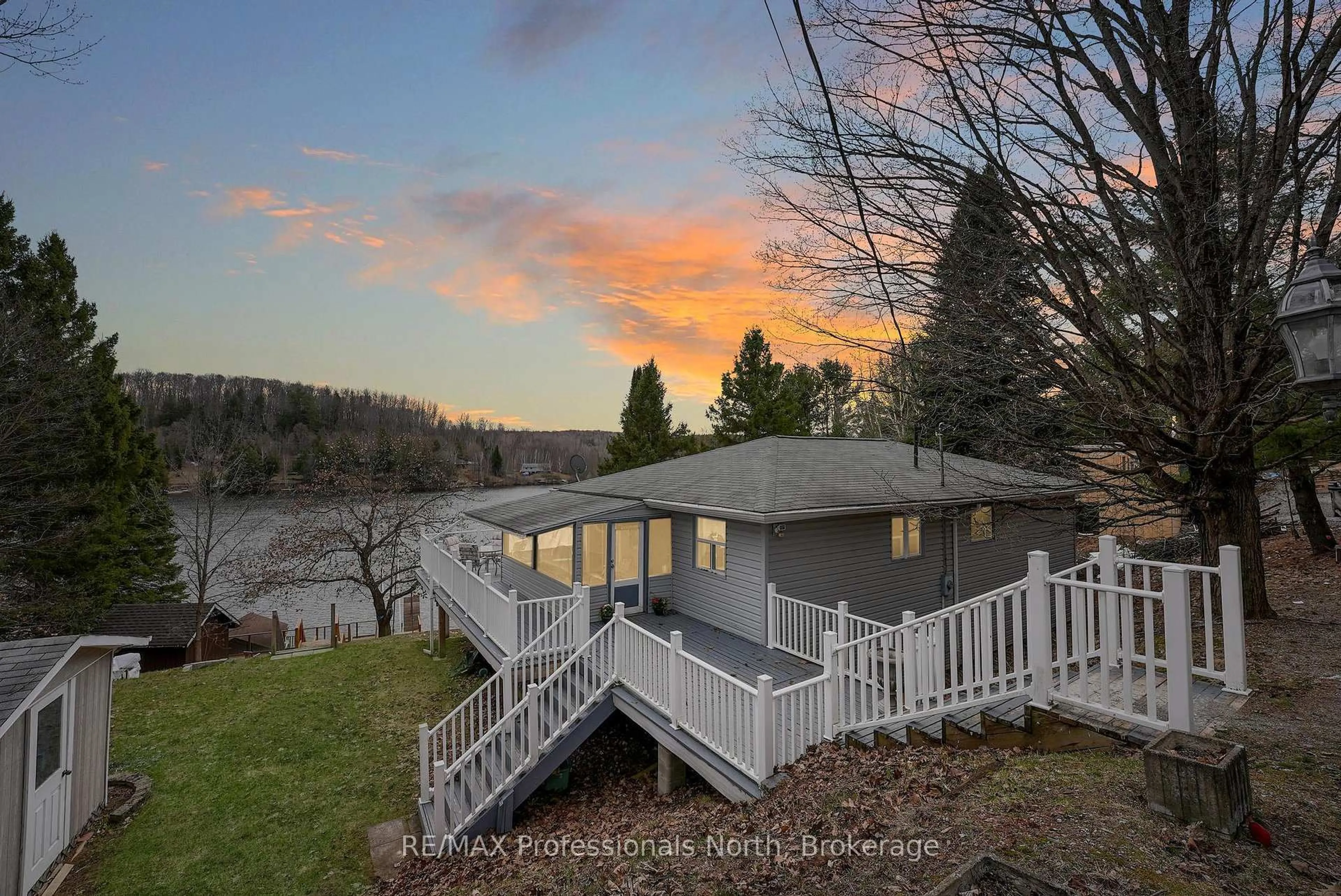 A pic from outside/outdoor area/front of a property/back of a property/a pic from drone, water/lake/river/ocean view for 1103 Summer Lane, Minden Hills Ontario K0M 2K0