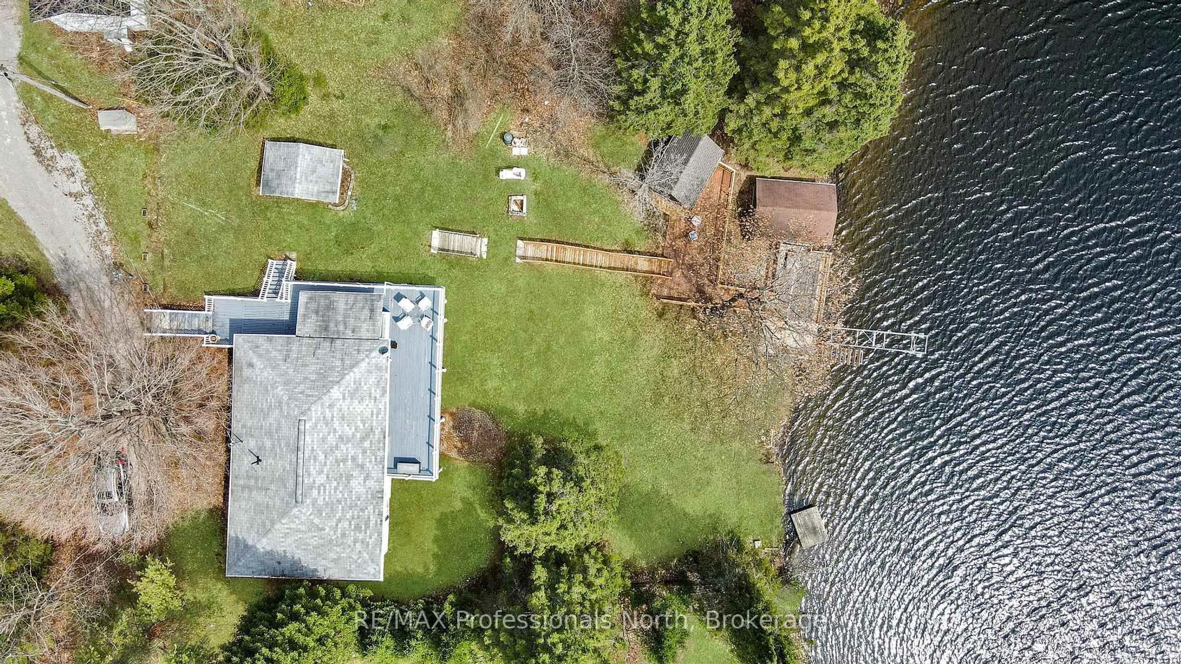 A pic from outside/outdoor area/front of a property/back of a property/a pic from drone, water/lake/river/ocean view for 1103 Summer Lane, Minden Hills Ontario K0M 2K0