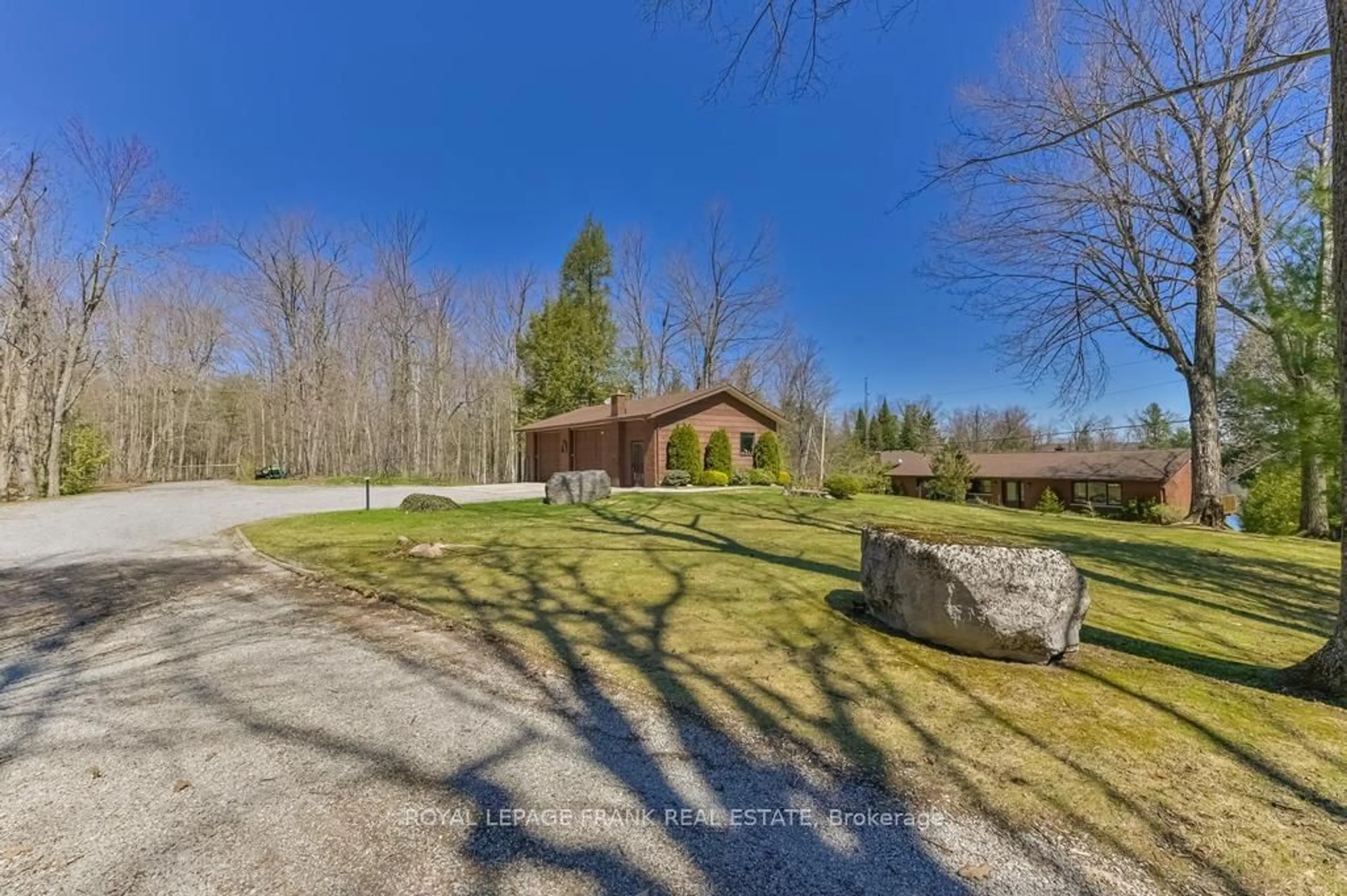 A pic from outside/outdoor area/front of a property/back of a property/a pic from drone, water/lake/river/ocean view for 36 Fire Route 28, Trent Lakes Ontario K0L 1J0