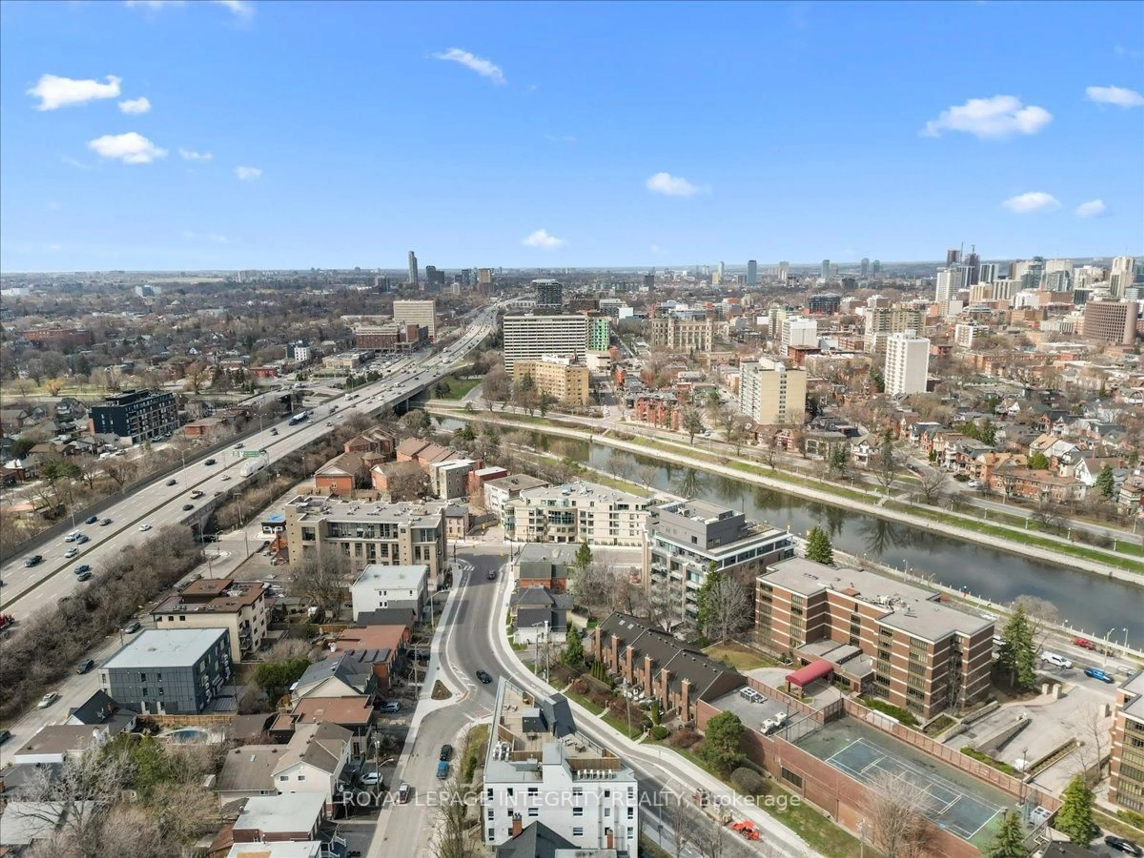 A pic from outside/outdoor area/front of a property/back of a property/a pic from drone, city buildings view from balcony for 150 Greenfield Ave #204, Ottawa Ontario K1S 0X8