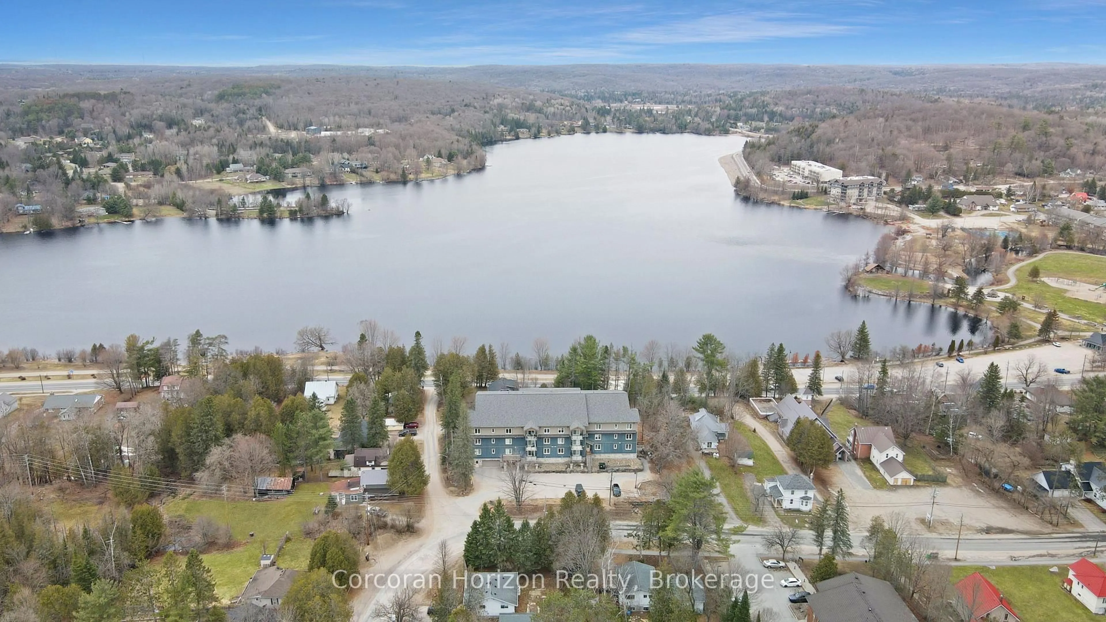 A pic from outside/outdoor area/front of a property/back of a property/a pic from drone, water/lake/river/ocean view for 4 Lake Ave #103, Dysart et al Ontario K0M 1S0