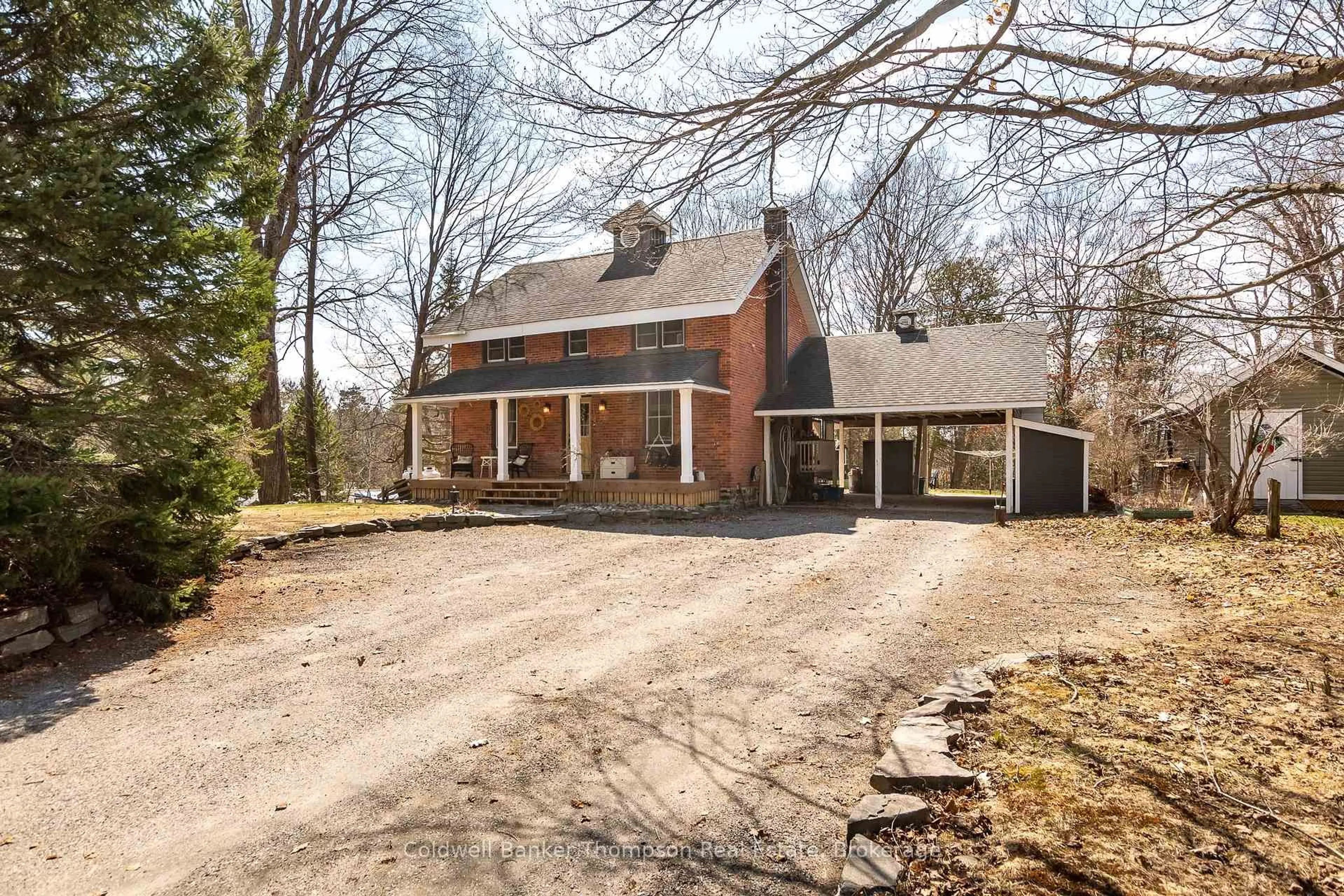 Home with brick exterior material, street for 1228 Milford Bay Rd, Muskoka Lakes Ontario P0B 1E0