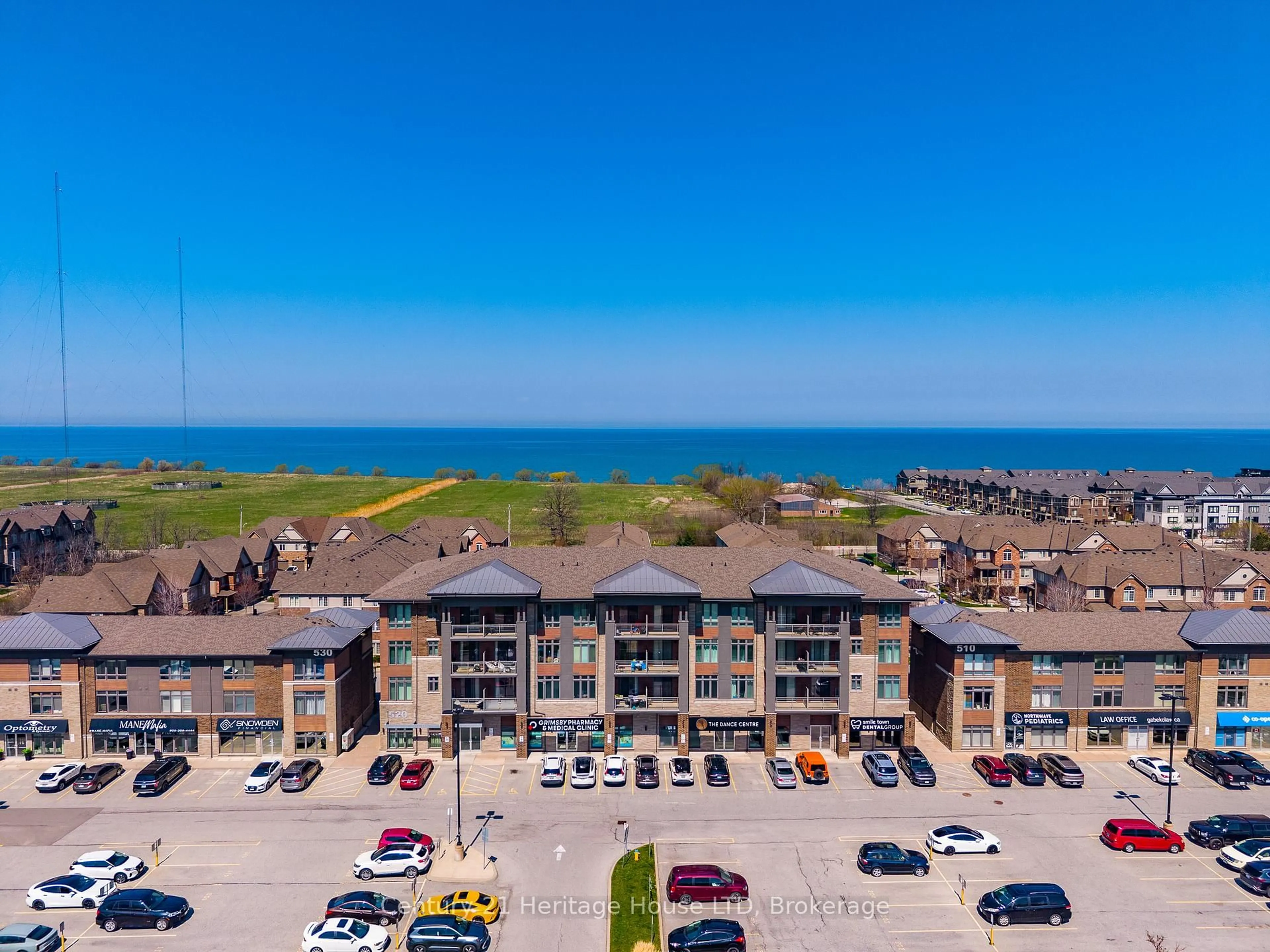 A pic from outside/outdoor area/front of a property/back of a property/a pic from drone, water/lake/river/ocean view for 520 North Service Rd #402, Grimsby Ontario L3M 0C9