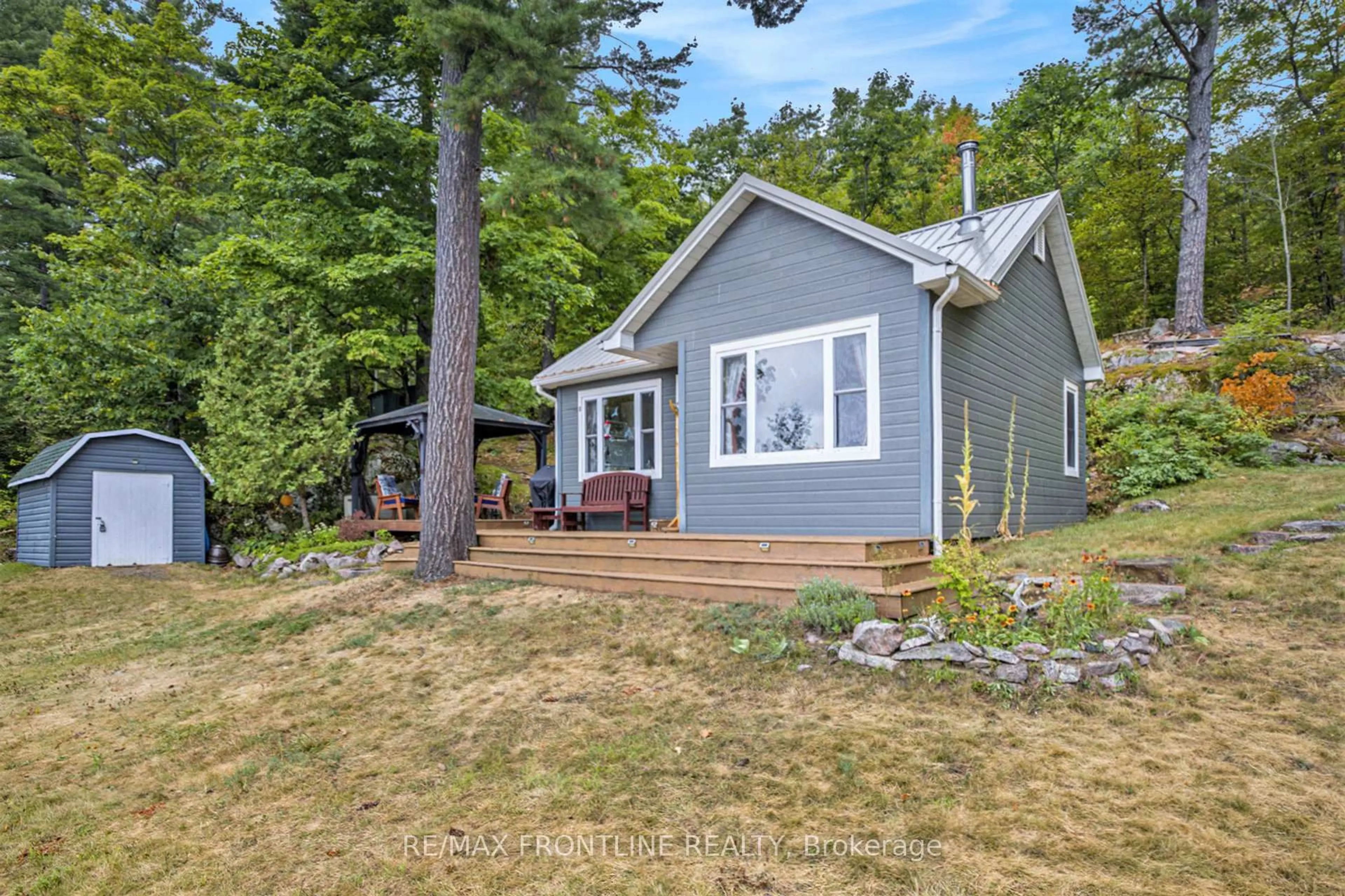 A pic from outside/outdoor area/front of a property/back of a property/a pic from drone, water/lake/river/ocean view for 1294 Harding Lane, Maberly Ontario K0H 2B0