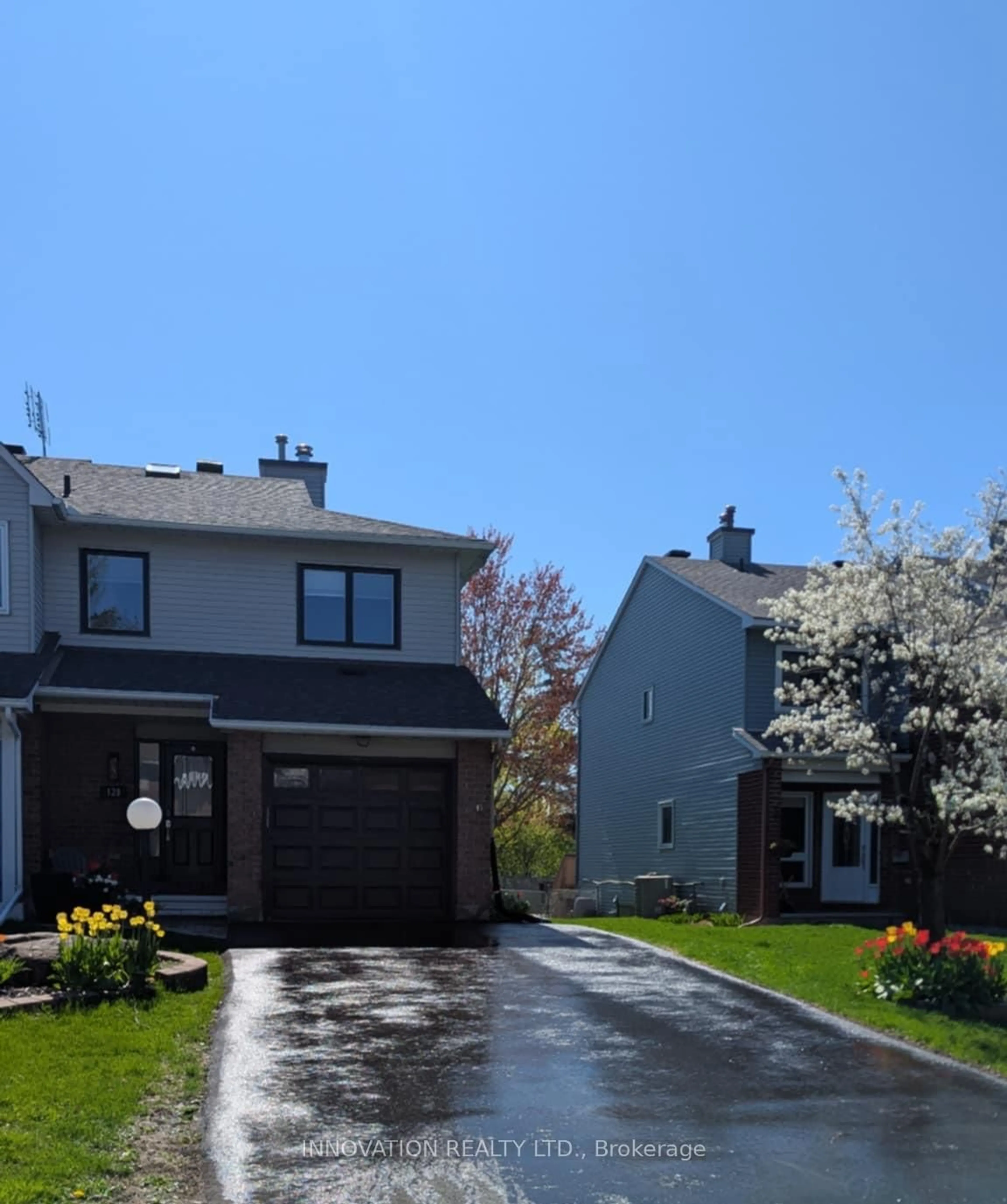 Home with vinyl exterior material, street for 128 Pickwick Dr, Barrhaven Ontario K2J 3C7