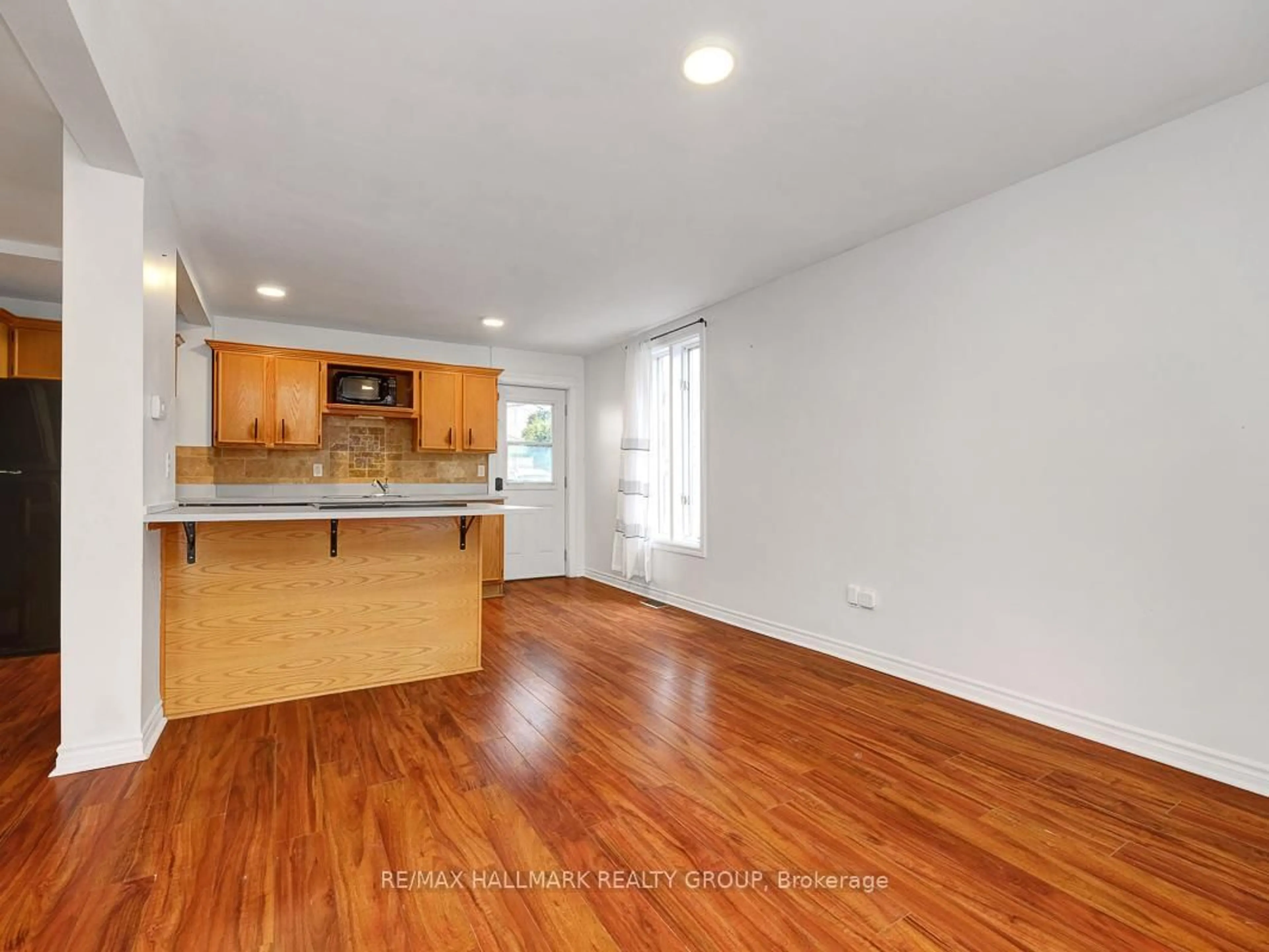 Open concept kitchen, wood/laminate floor for 193 Gladu St, Ottawa Ontario K1L 6N3