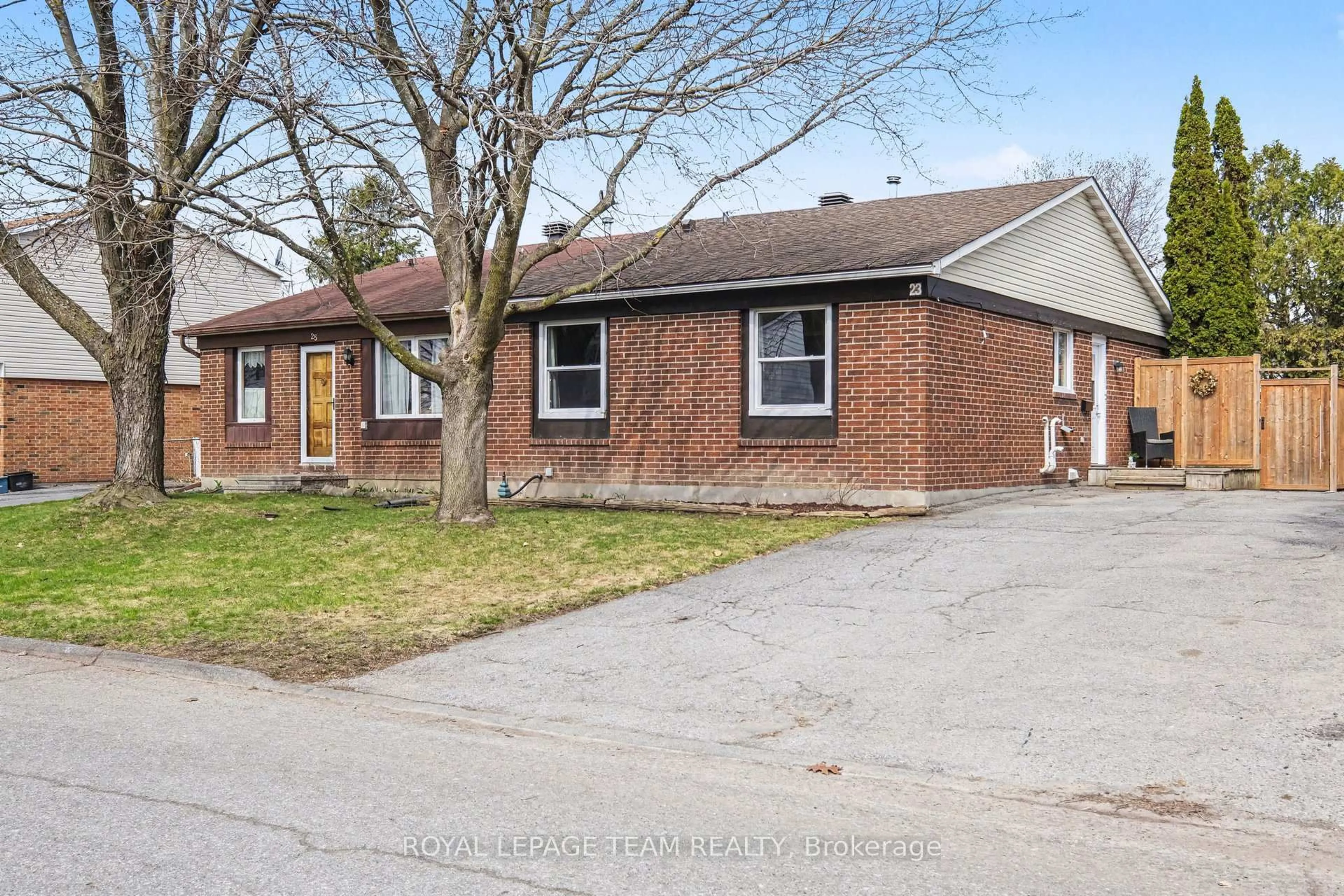 Home with brick exterior material, street for 23 Spearman Lane, Ottawa Ontario K2L 1Y6