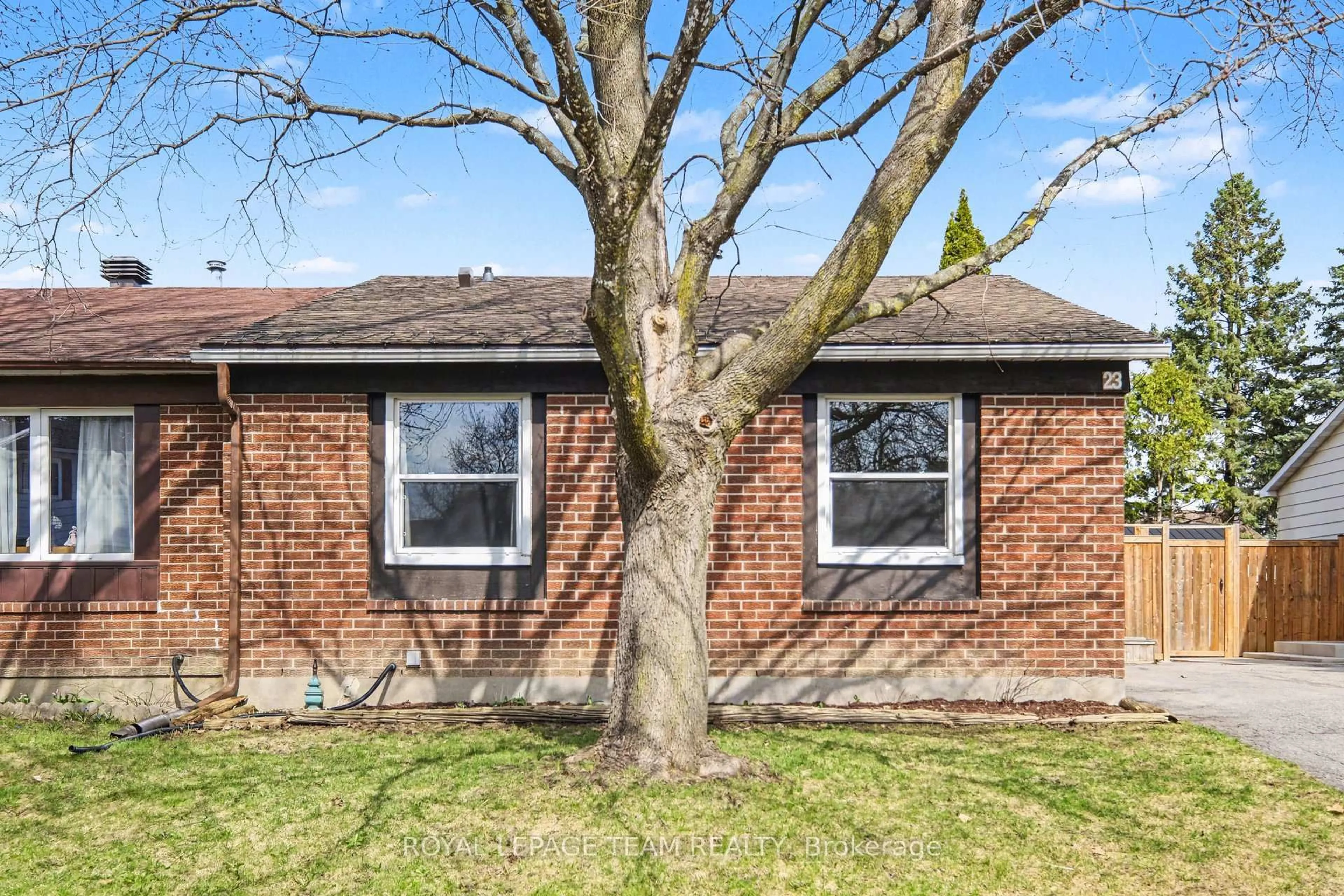 Home with brick exterior material, street for 23 Spearman Lane, Ottawa Ontario K2L 1Y6