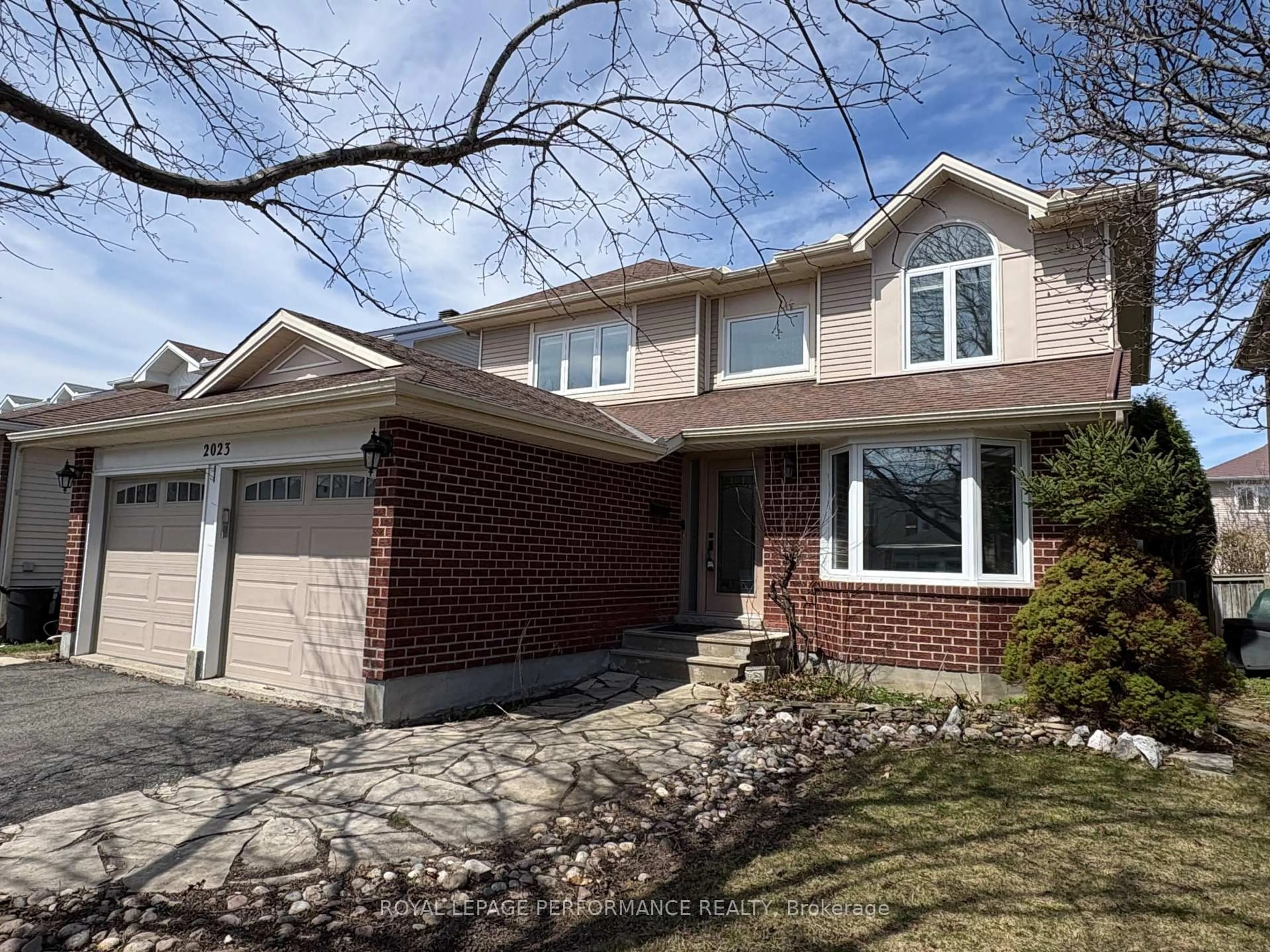 Home with brick exterior material, street for 2023 Rolling Brook Dr, Ottawa Ontario K1W 1C9