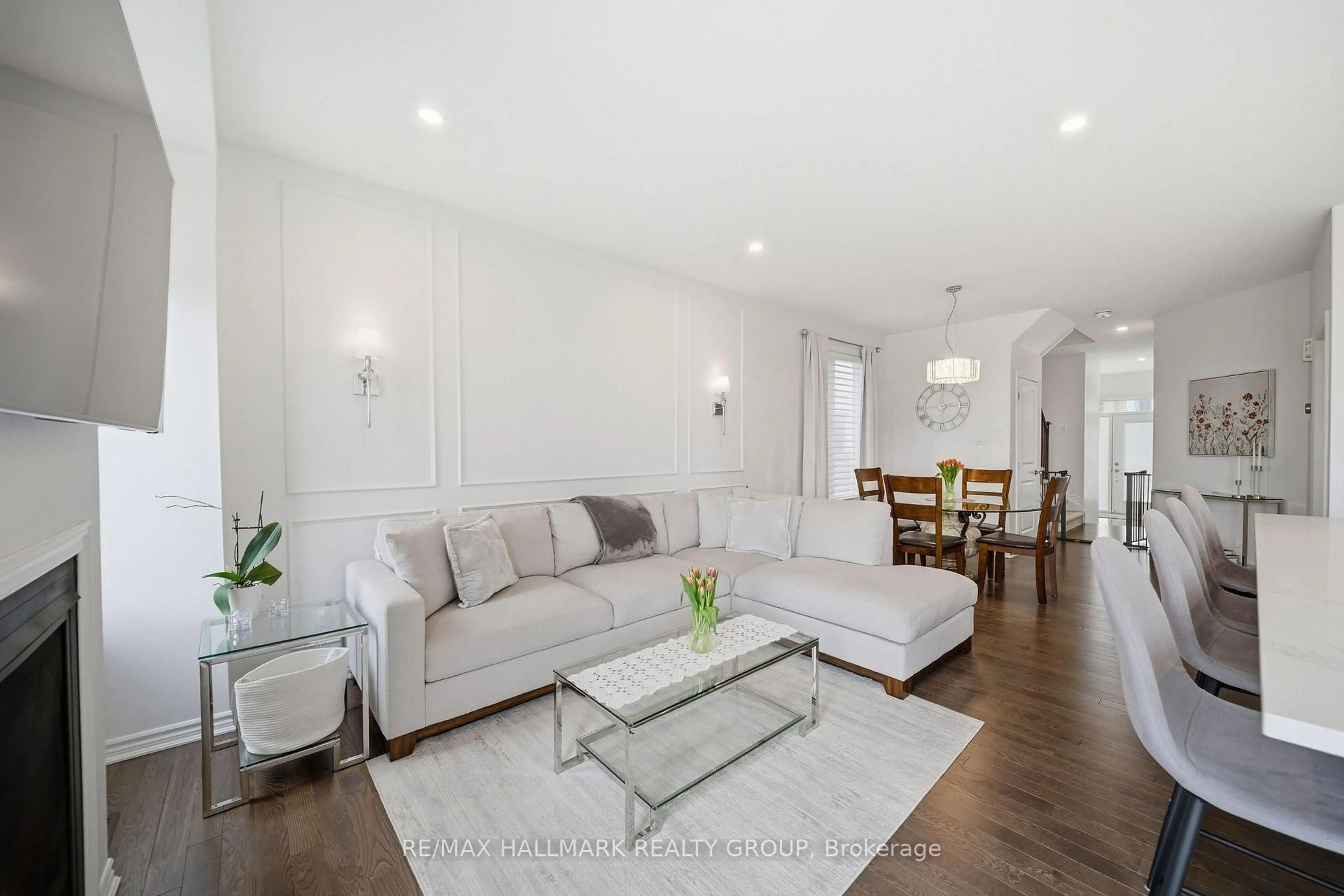 Living room with furniture, wood/laminate floor for 278 Livery St, Stittsville Ontario K2V 0S1