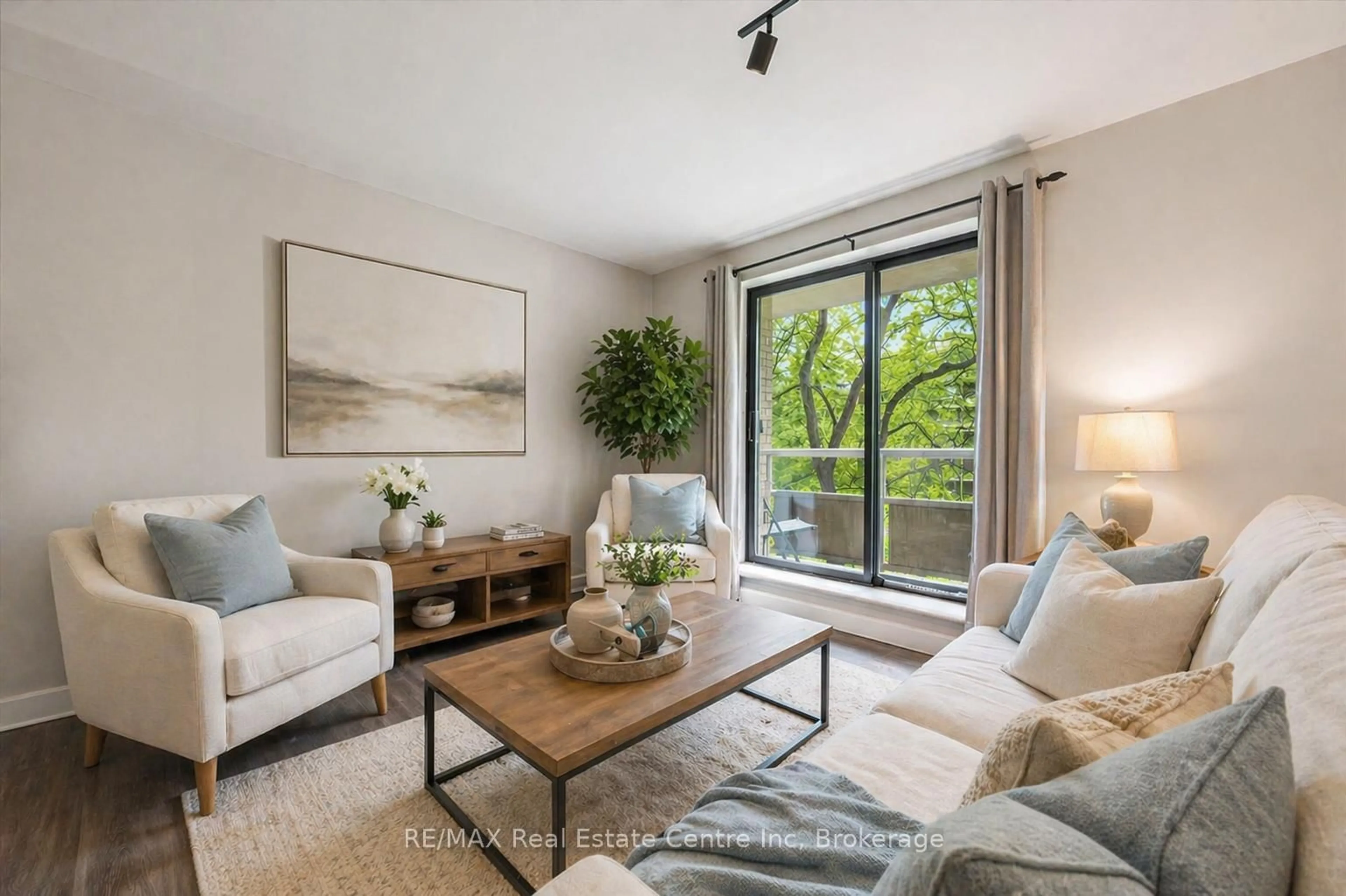 Living room with furniture, unknown for 89 WESTWOOD Rd #302, Guelph Ontario N1H 7J6