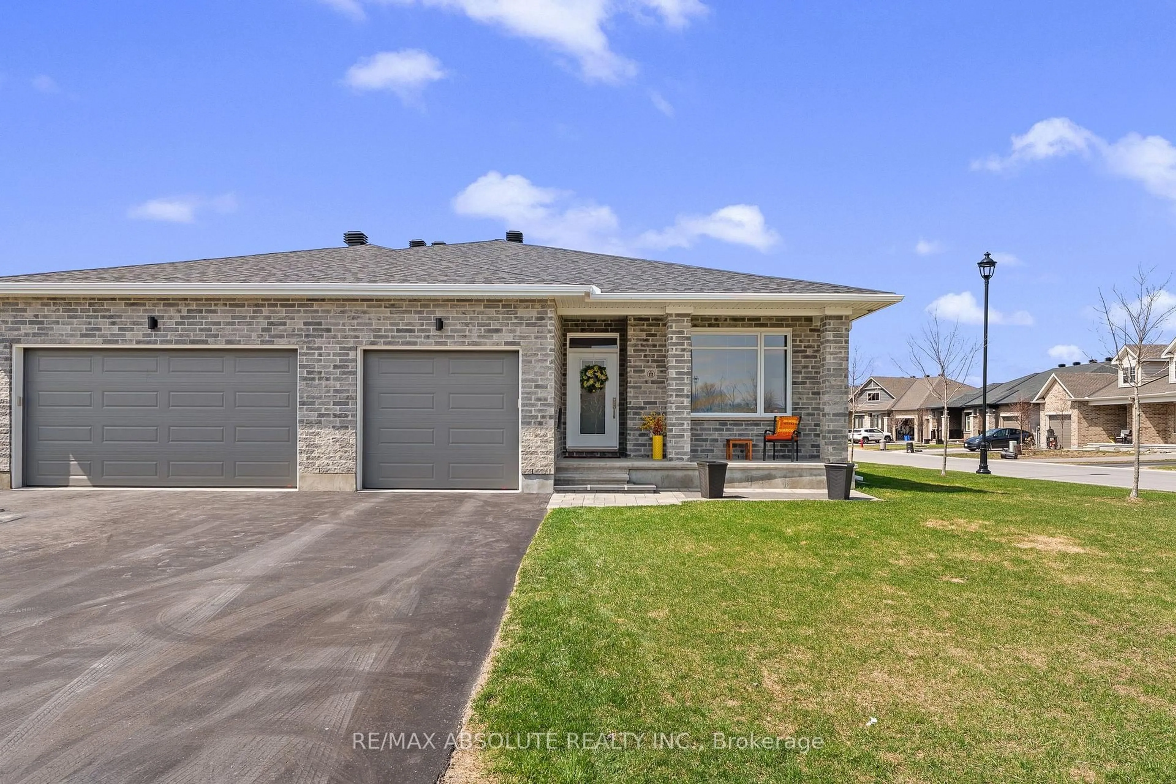 Home with brick exterior material, street for 22 Ernie Godin Way, Arnprior Ontario K7S 0J5