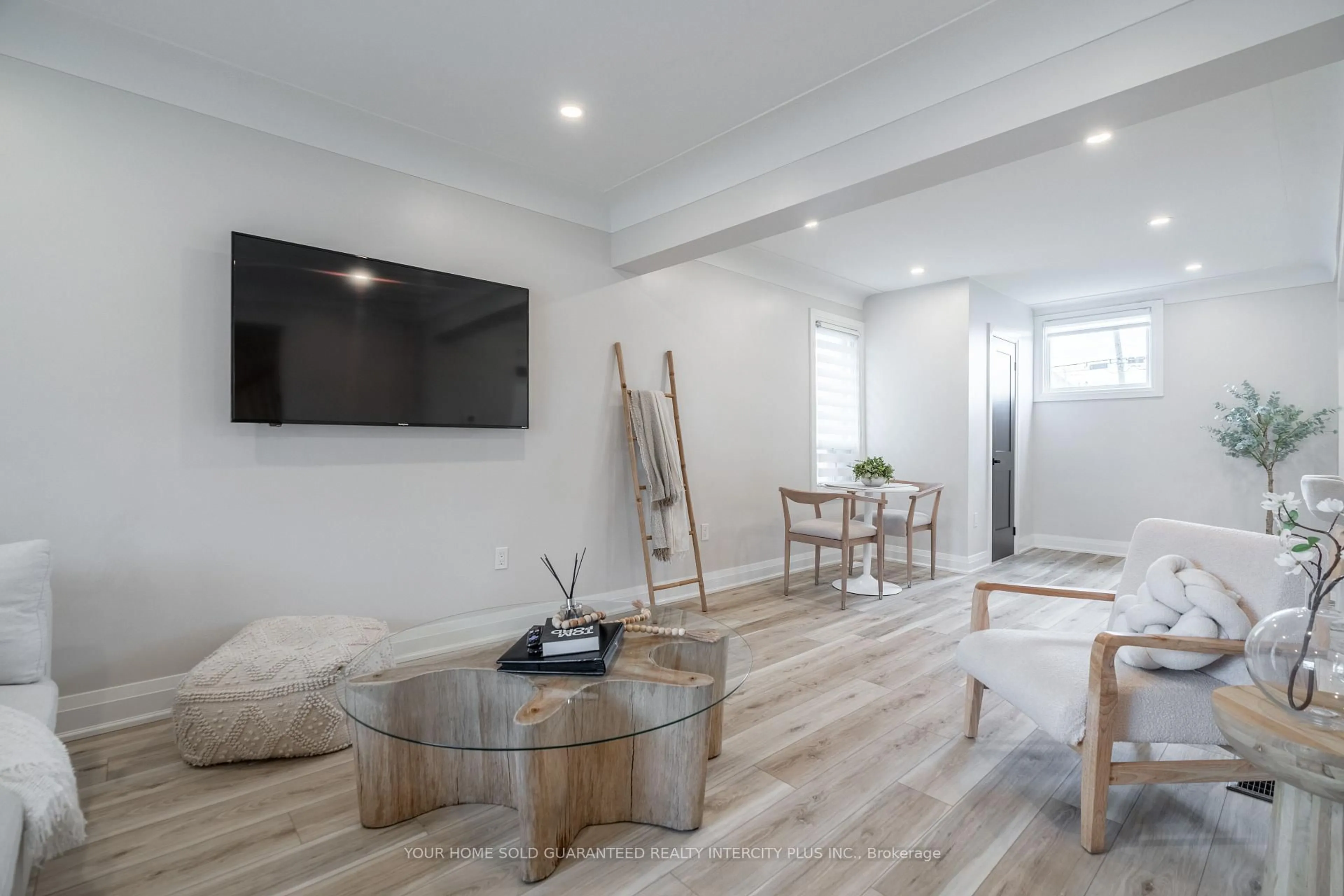 Living room with furniture, wood/laminate floor for 235 Balmoral Ave, Hamilton Ontario L8L 7S1