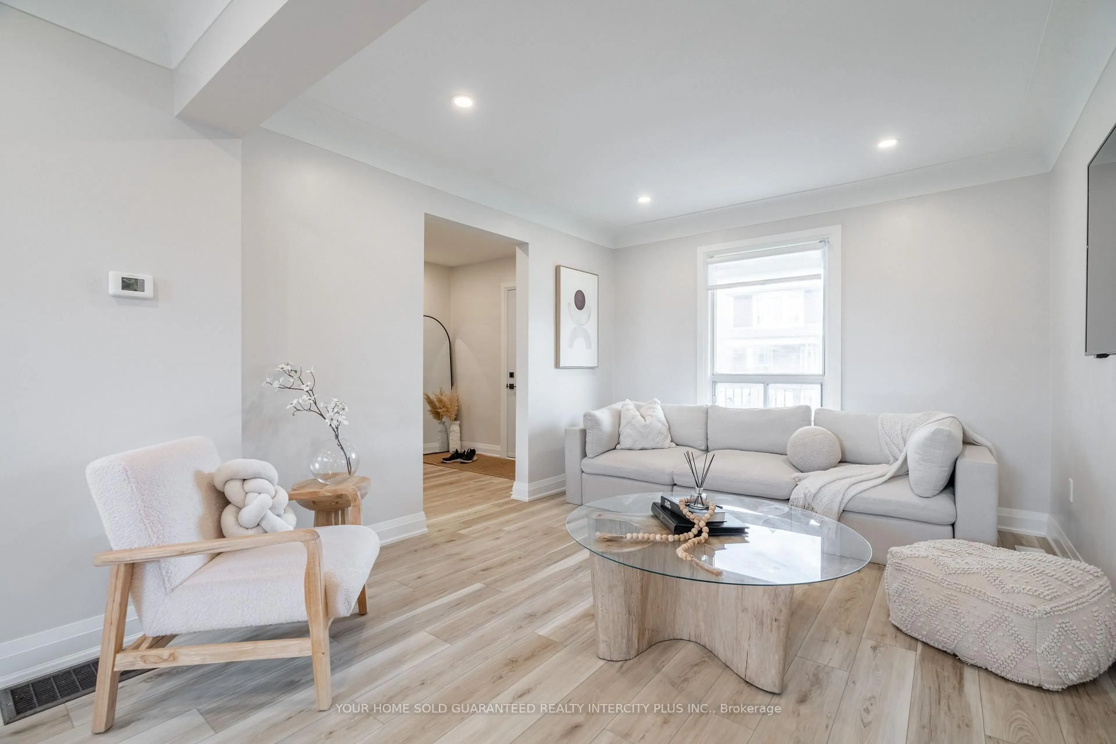 Living room with furniture, wood/laminate floor for 235 Balmoral Ave, Hamilton Ontario L8L 7S1