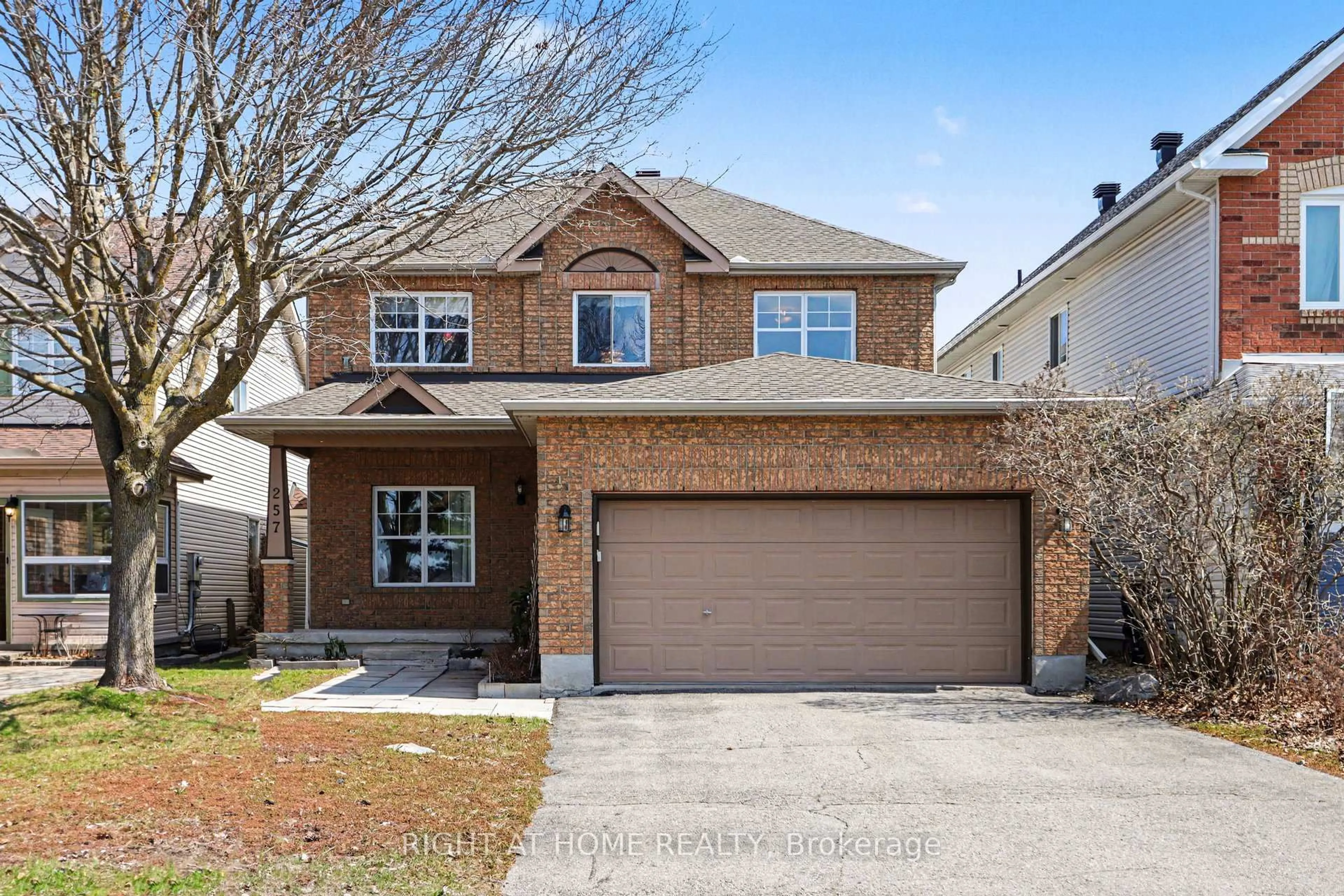 Home with brick exterior material, street for 257 Stoneway Dr, Ottawa Ontario K2G 6E9