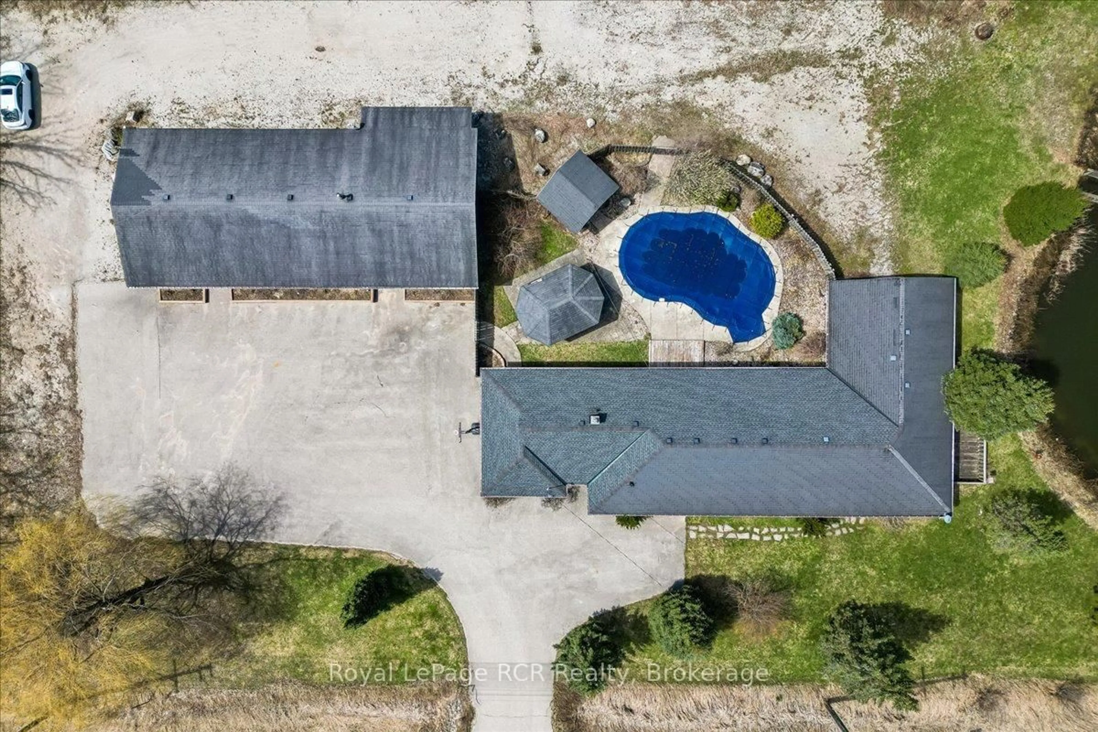 A pic from outside/outdoor area/front of a property/back of a property/a pic from drone, unknown for 717906 6 Highway, Georgian Bluffs Ontario N4K 5N7