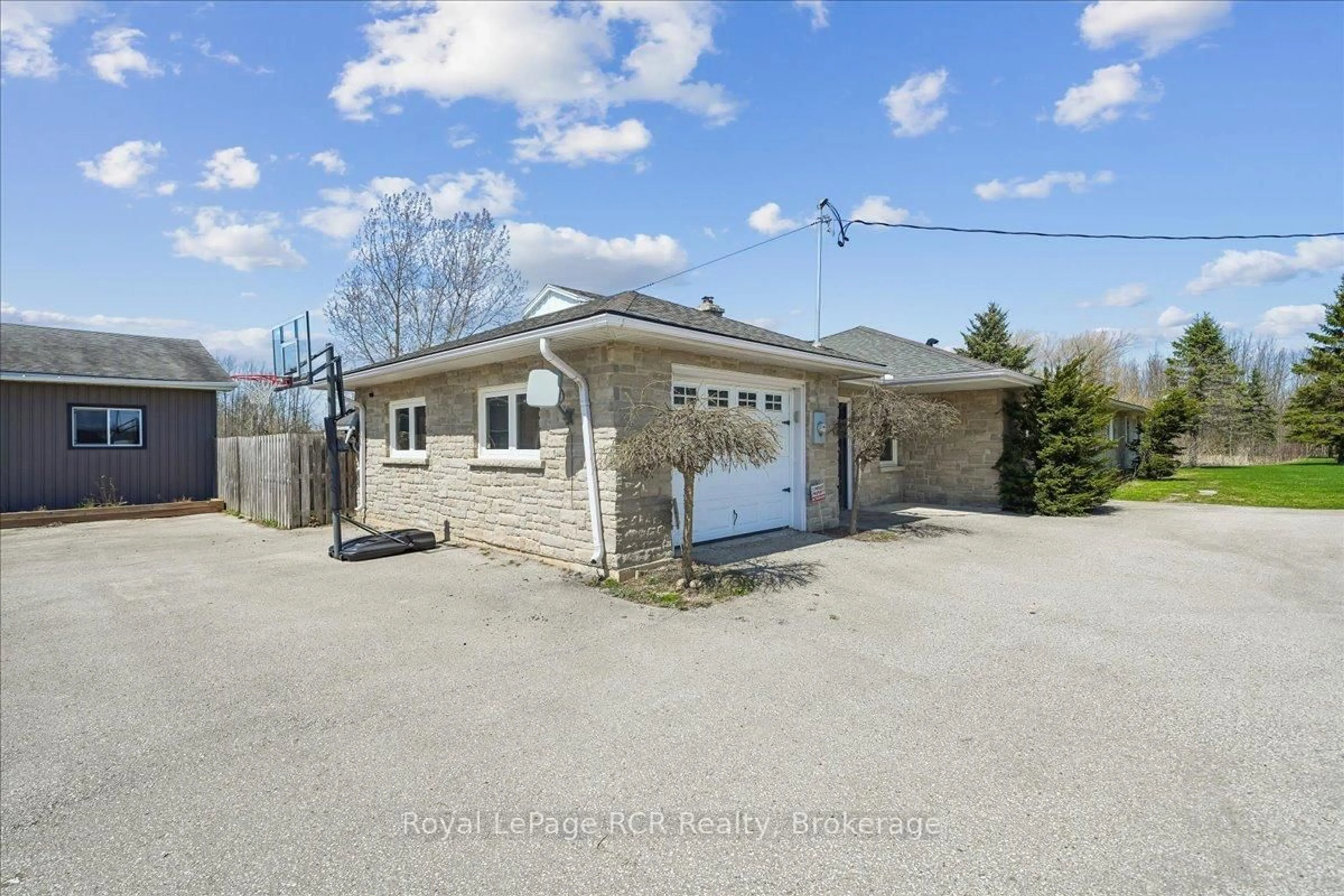 A pic from outside/outdoor area/front of a property/back of a property/a pic from drone, street for 717906 6 Highway, Georgian Bluffs Ontario N4K 5N7
