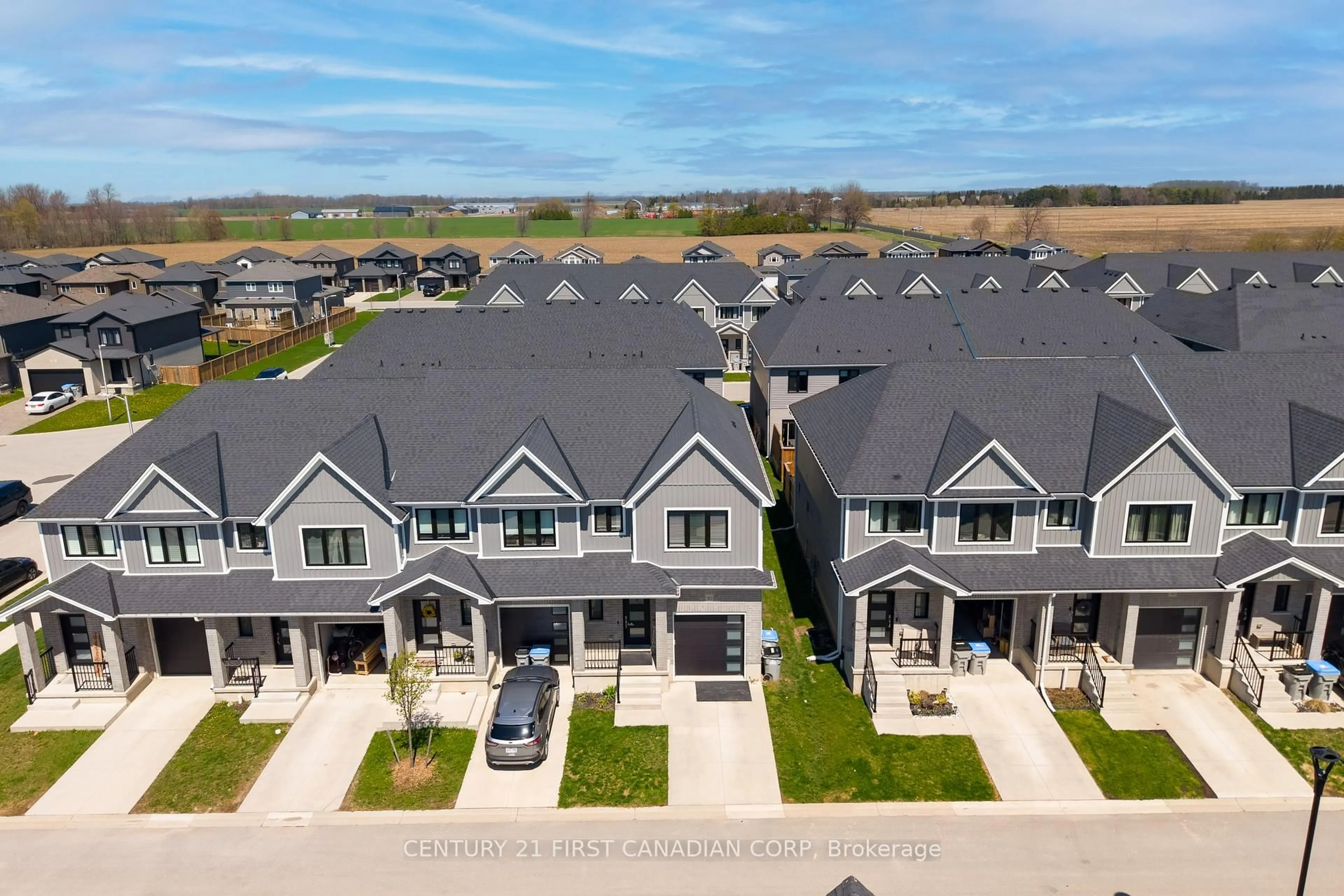 A pic from outside/outdoor area/front of a property/back of a property/a pic from drone, unknown for 1-30 Miller Dr, Lucan Biddulph Ontario N0M 2J0