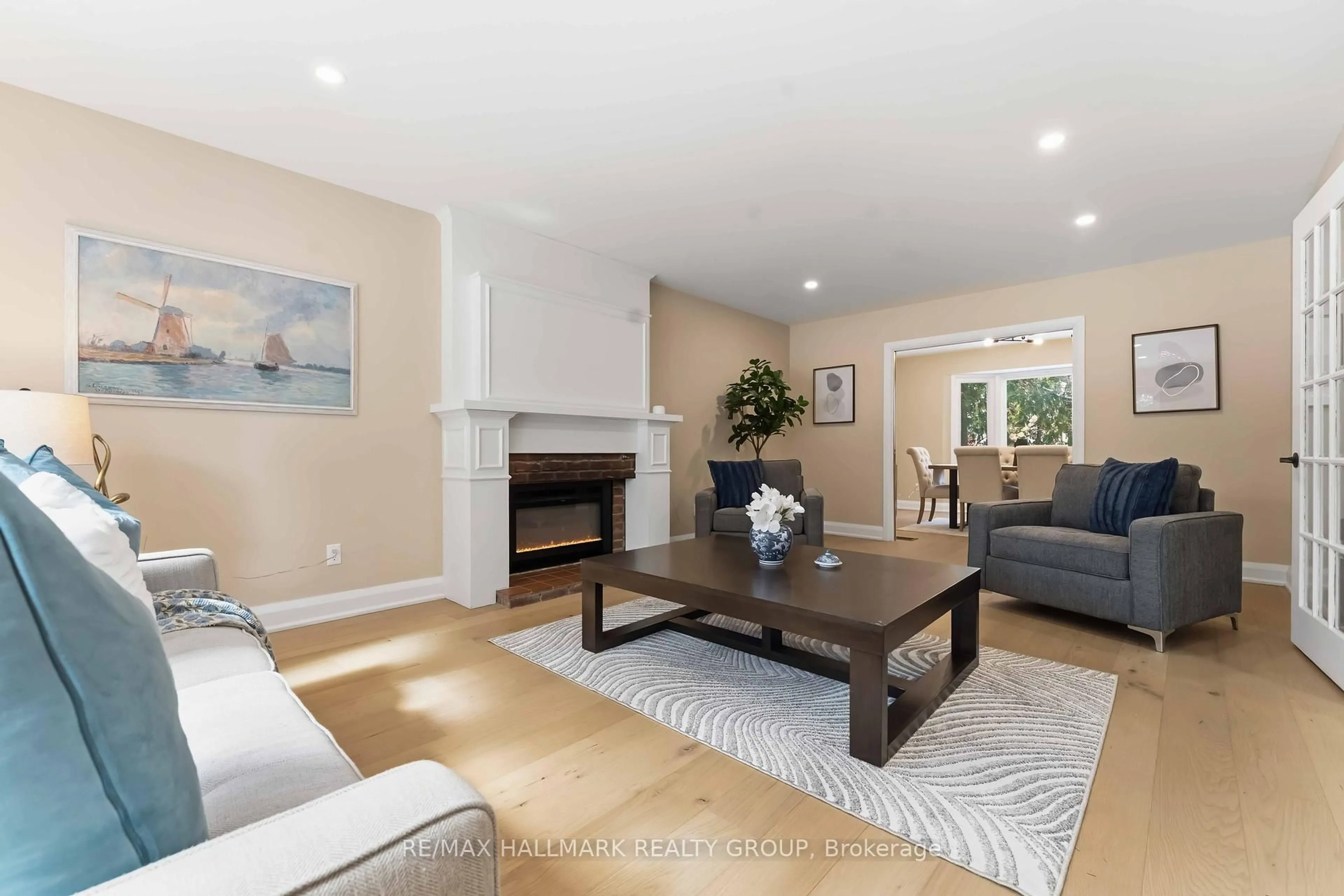 Living room with furniture, wood/laminate floor for 19 Kingsford Cres, Ottawa Ontario K2K 1T5